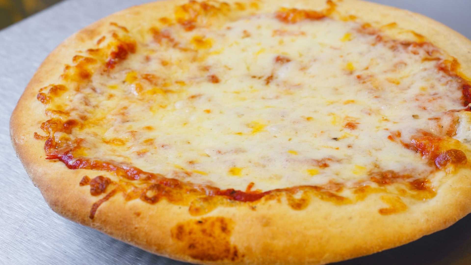 Order Cheese Pizza - Small 10'' food online from Abe's Pizza store, San Francisco on bringmethat.com