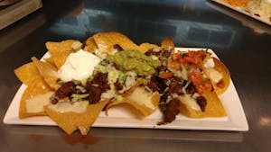 Order 174. Tex-Mex Nachos food online from La Tolteca store, Williamsburg on bringmethat.com
