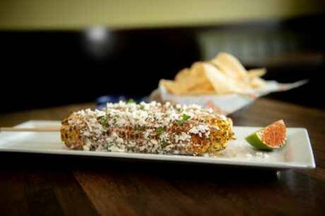 Order Grilled Corn On The Cob food online from Frontera Mex-Mex Grill store, Loganville on bringmethat.com