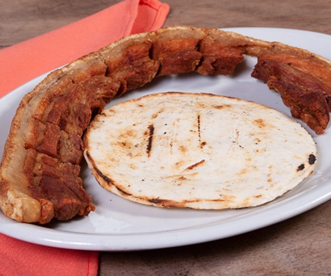 Order Chicharron con Arepa / Pork Skin with Corn Cake food online from Mr. Mario store, College Point on bringmethat.com