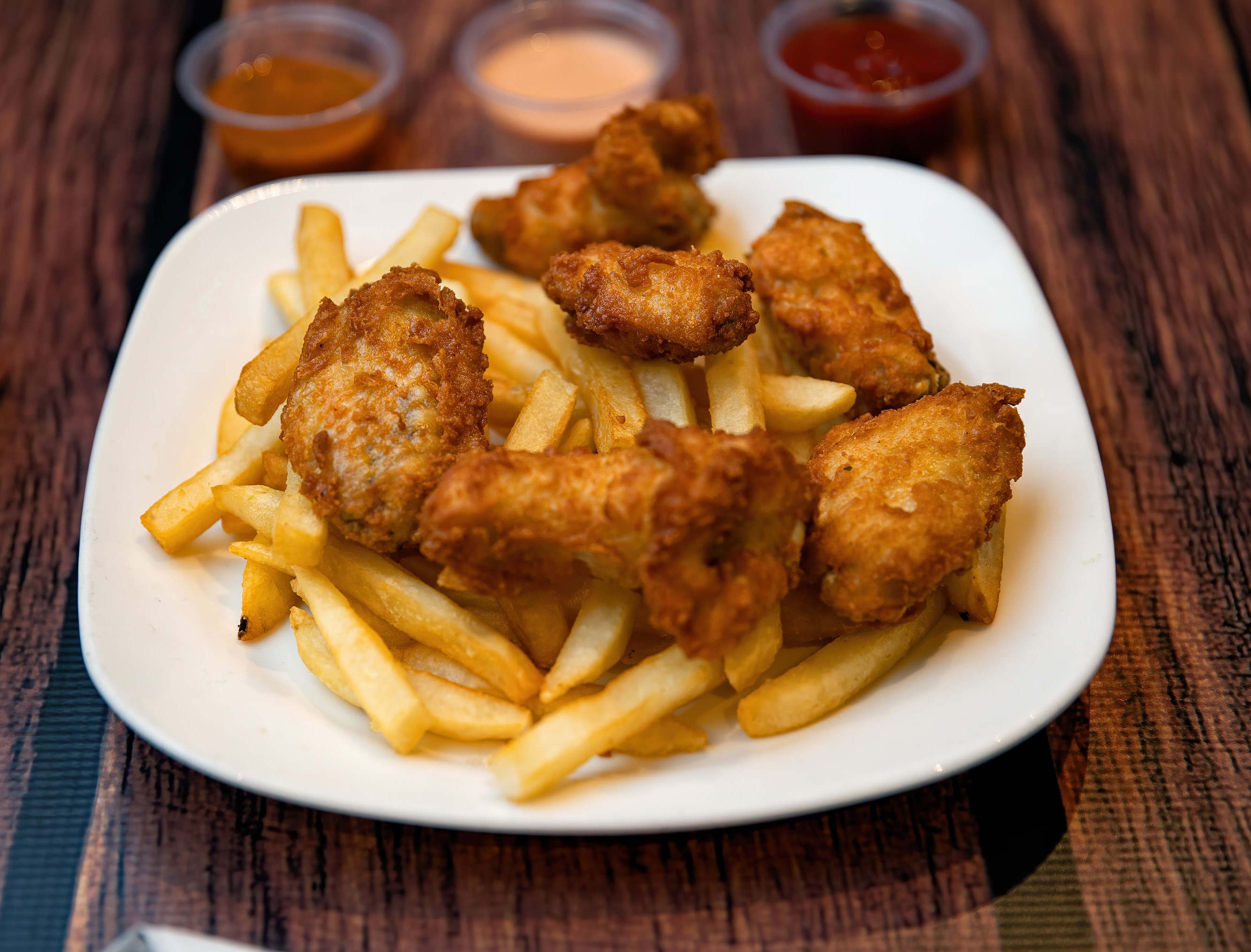 Order Alitas de Pollo & French fries food online from Noches De Colombia store, Randolph on bringmethat.com