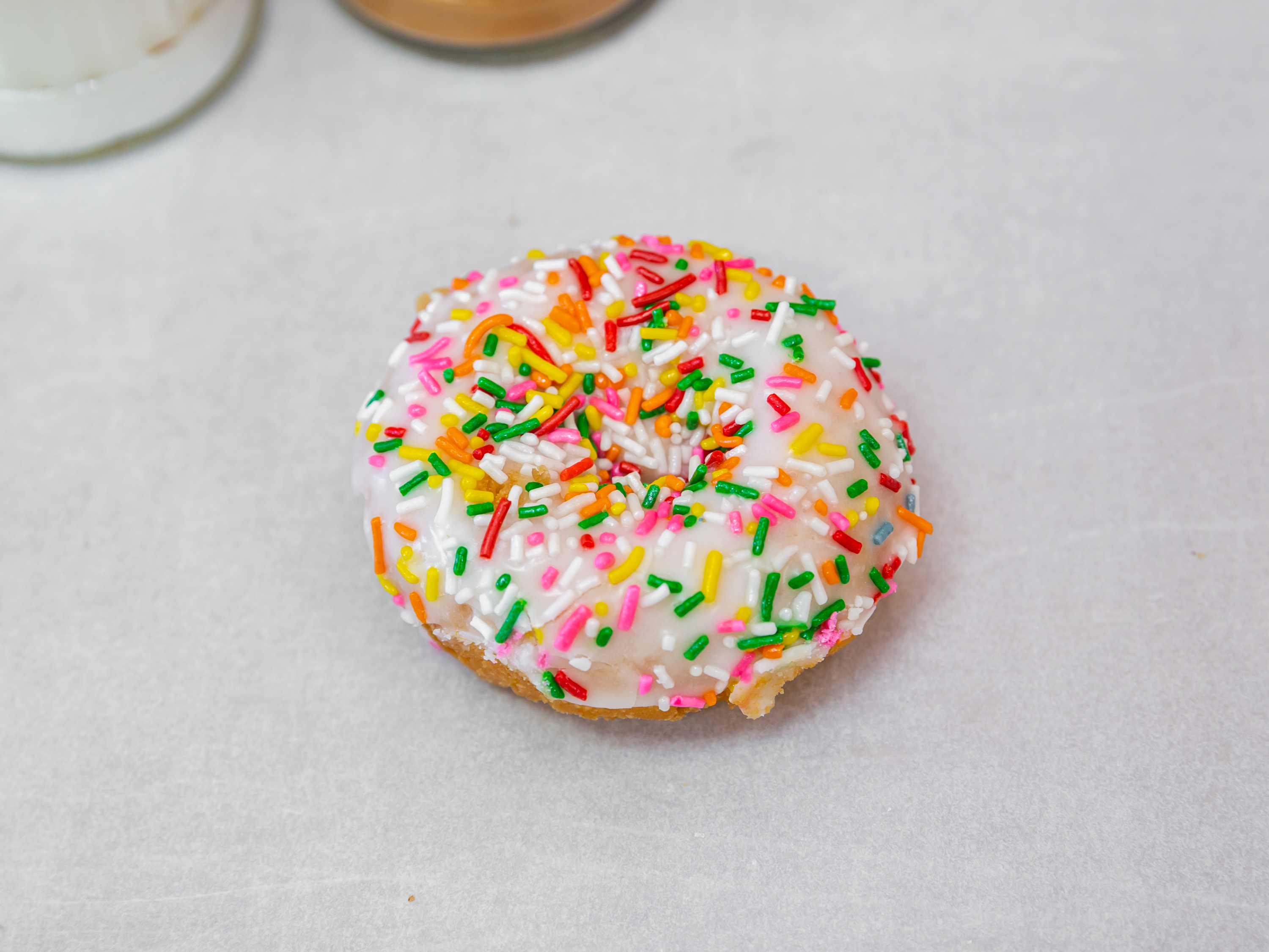 Order Cake Donut with Vanilla Icing and Rainbow Sprinkles food online from Jax Donut House store, Anaheim on bringmethat.com