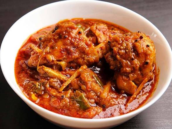 Order Achari chicken curry food online from Baisakhi Dhaba store, Johnson City on bringmethat.com