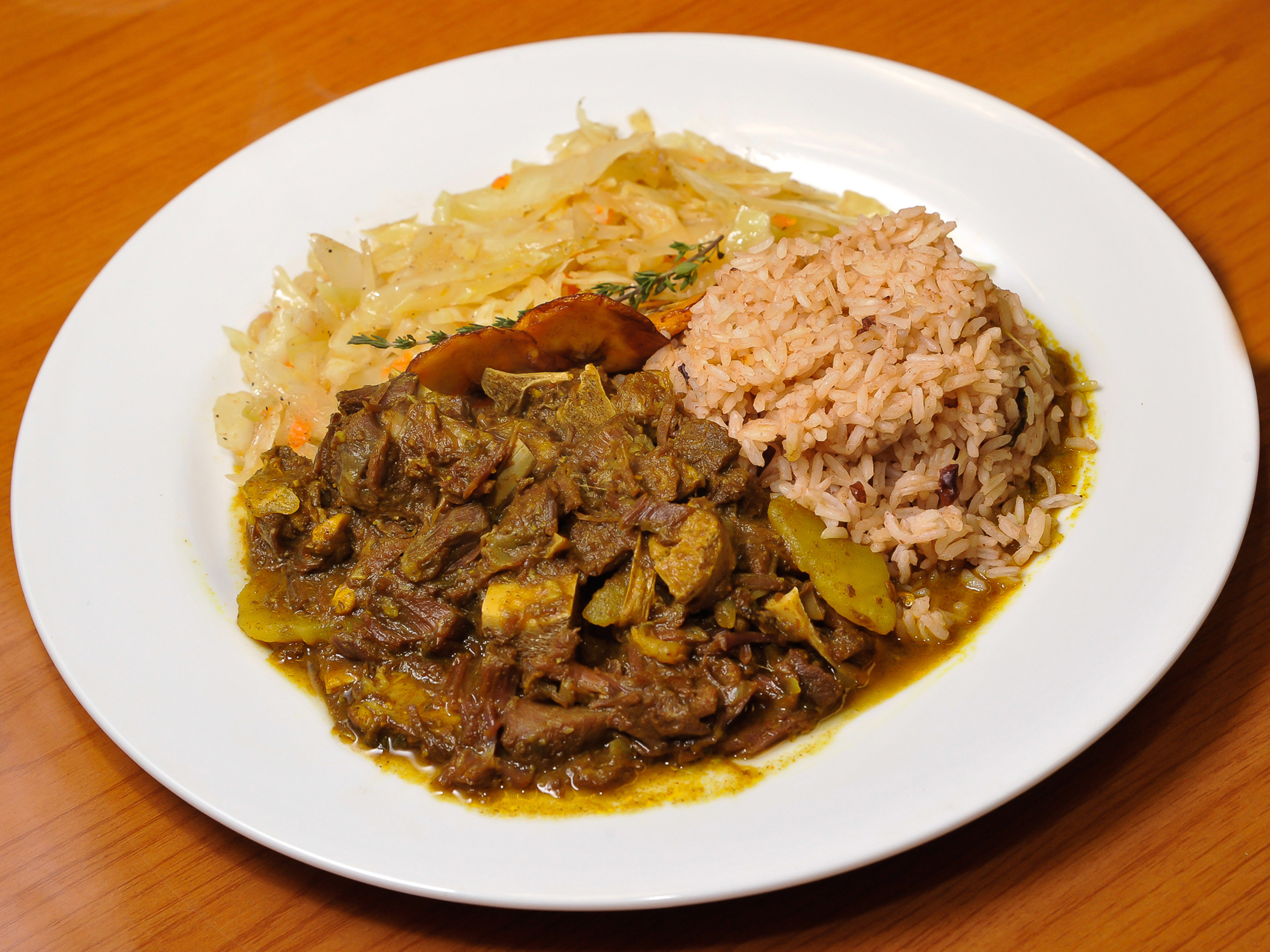 Order Curry Goat food online from Irie Mon Cafe store, Atlanta on bringmethat.com