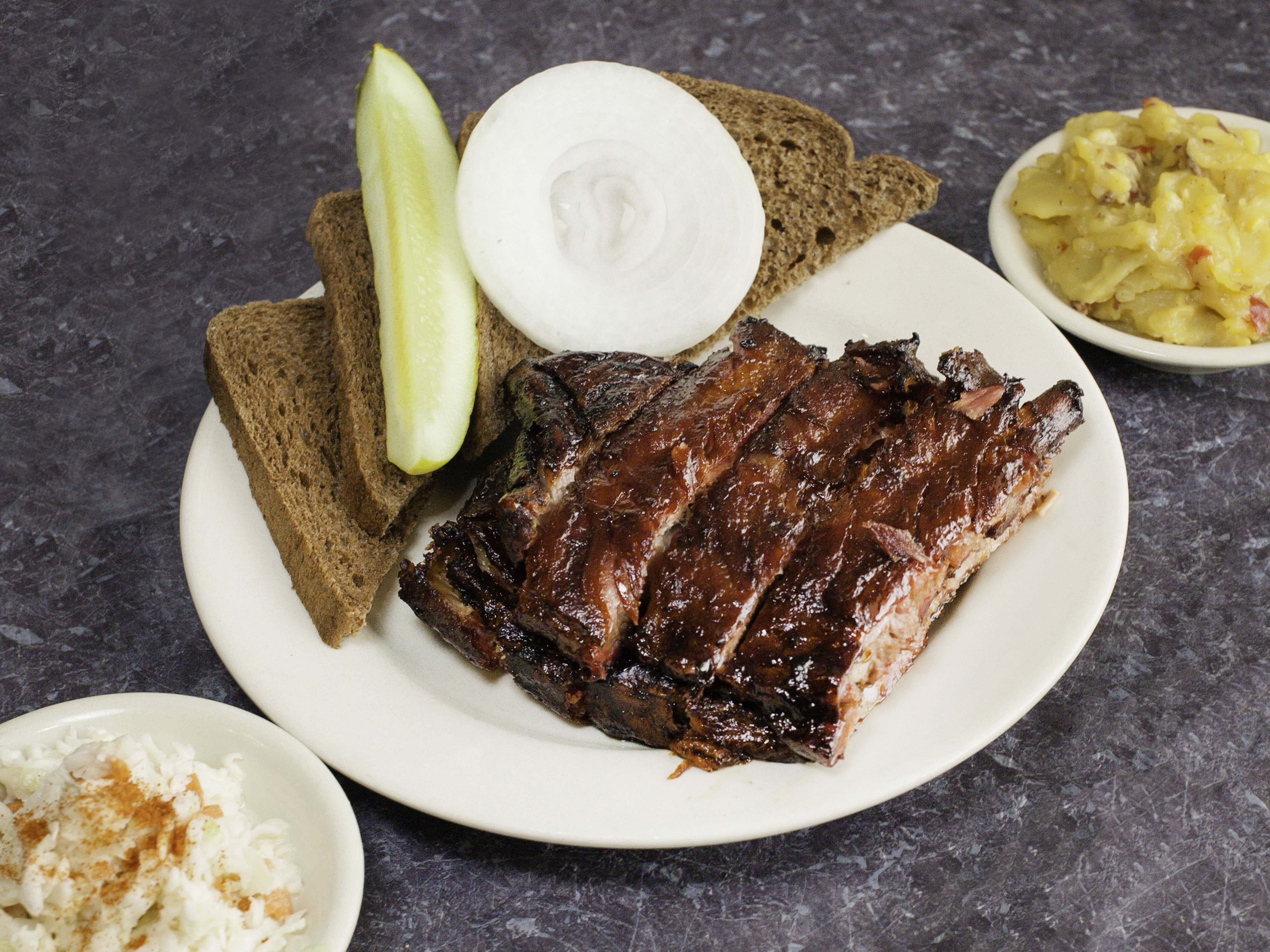 Order BBQ Baby Back Ribs Dinner Half Rack food online from Wolf's Bar-B-Q store, Evansville on bringmethat.com