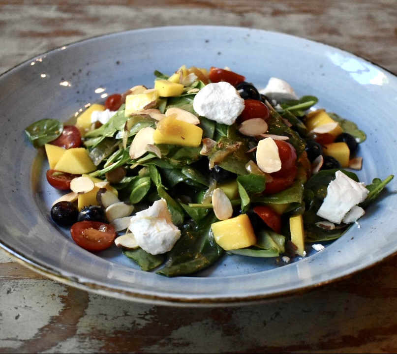 Order Spinach and Fruit Salad food online from Busboys and Poets store, Washington on bringmethat.com