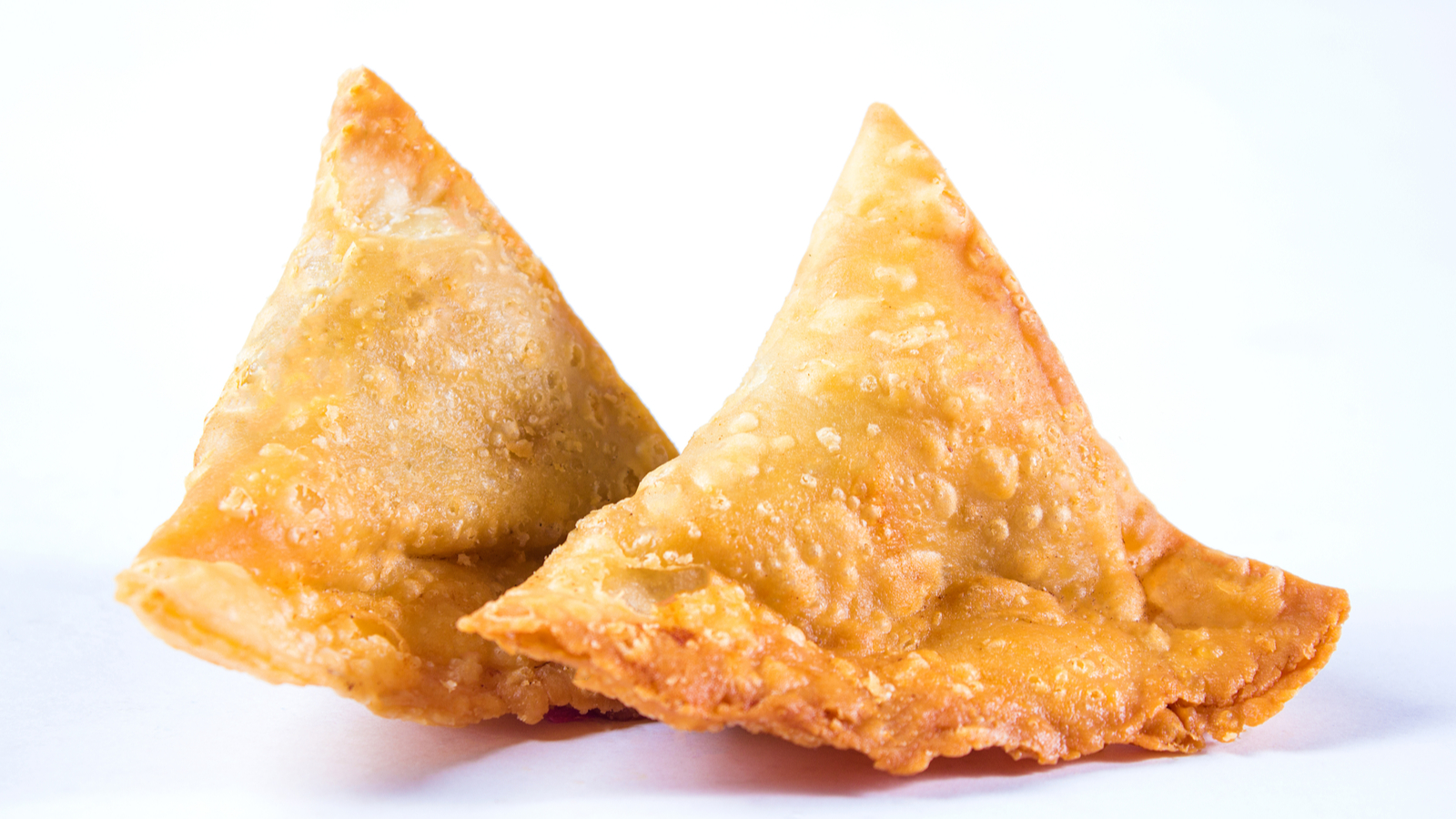 Order 2 Pieces Vegetable Samosa food online from Vegetarian Indian Cafe store, Fremont on bringmethat.com