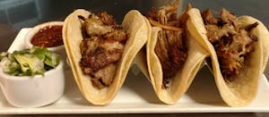 Order 96. Tacos de Carnitas food online from La Tolteca store, Williamsburg on bringmethat.com