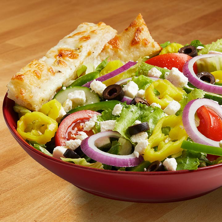 Order Greek Salad food online from Gino's Pizza and Luncheonette store, Belleville on bringmethat.com