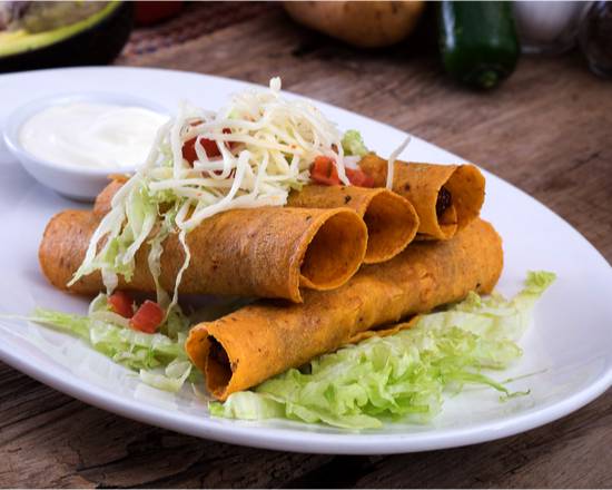 Order Three Taquitos food online from The Mexican Taqueria store, Long Beach on bringmethat.com