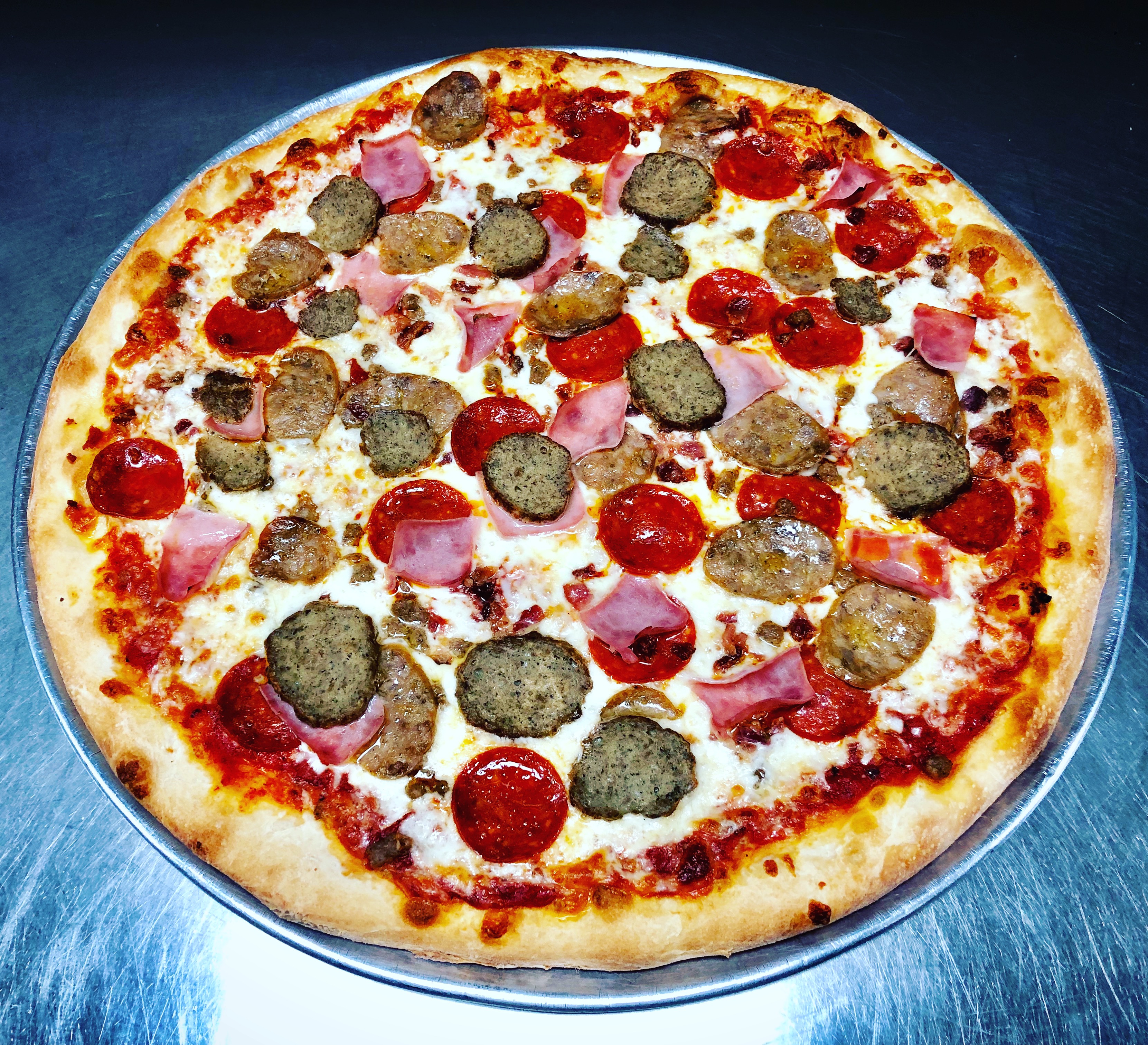 Order The Meat Feast Specialty Pizza food online from Vinny Italian Grill store, Fredericksburg on bringmethat.com