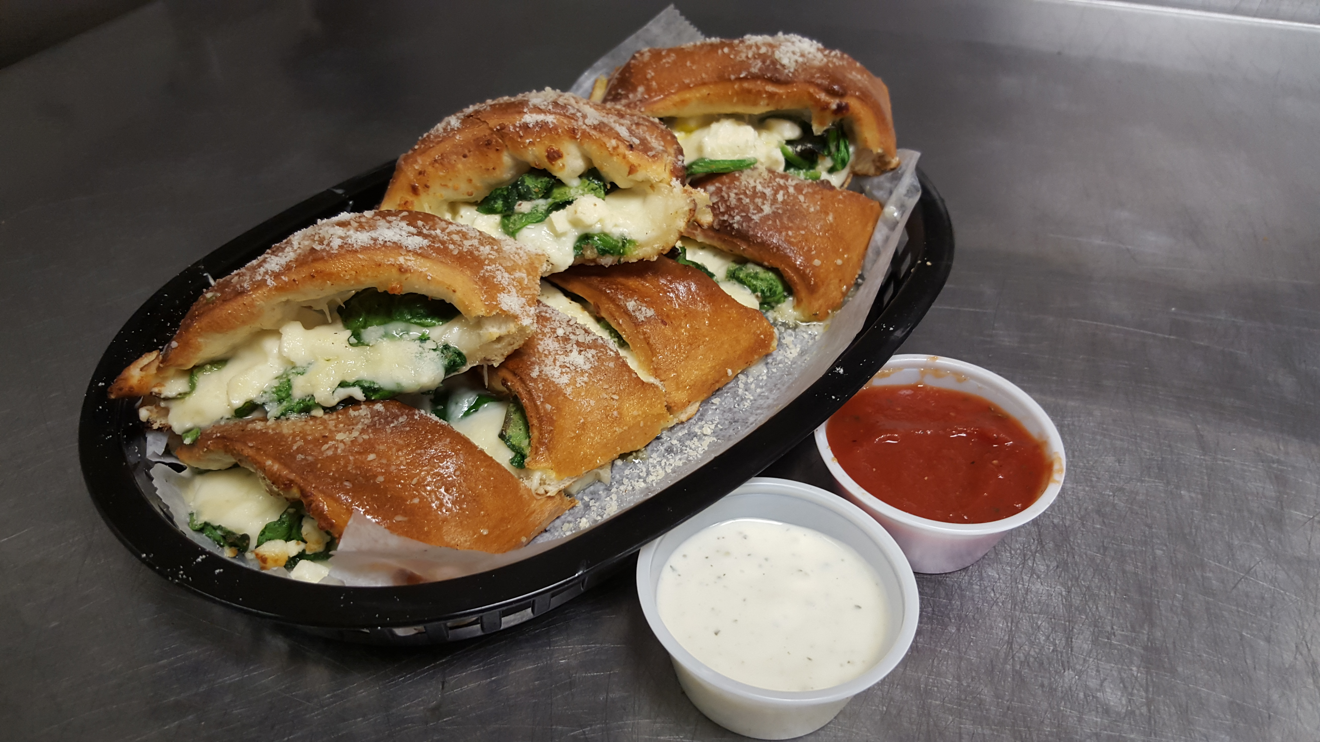 Order Spinach Feta Rolls food online from Mancinos Pizzas and Grinders store, Ann Arbor on bringmethat.com