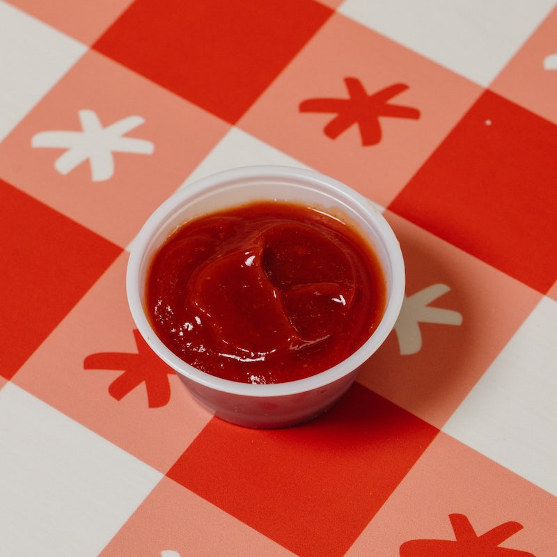 Order EXTRA HOT KETCHUP CUP food online from Hot Chicken Takeover store, Columbus on bringmethat.com