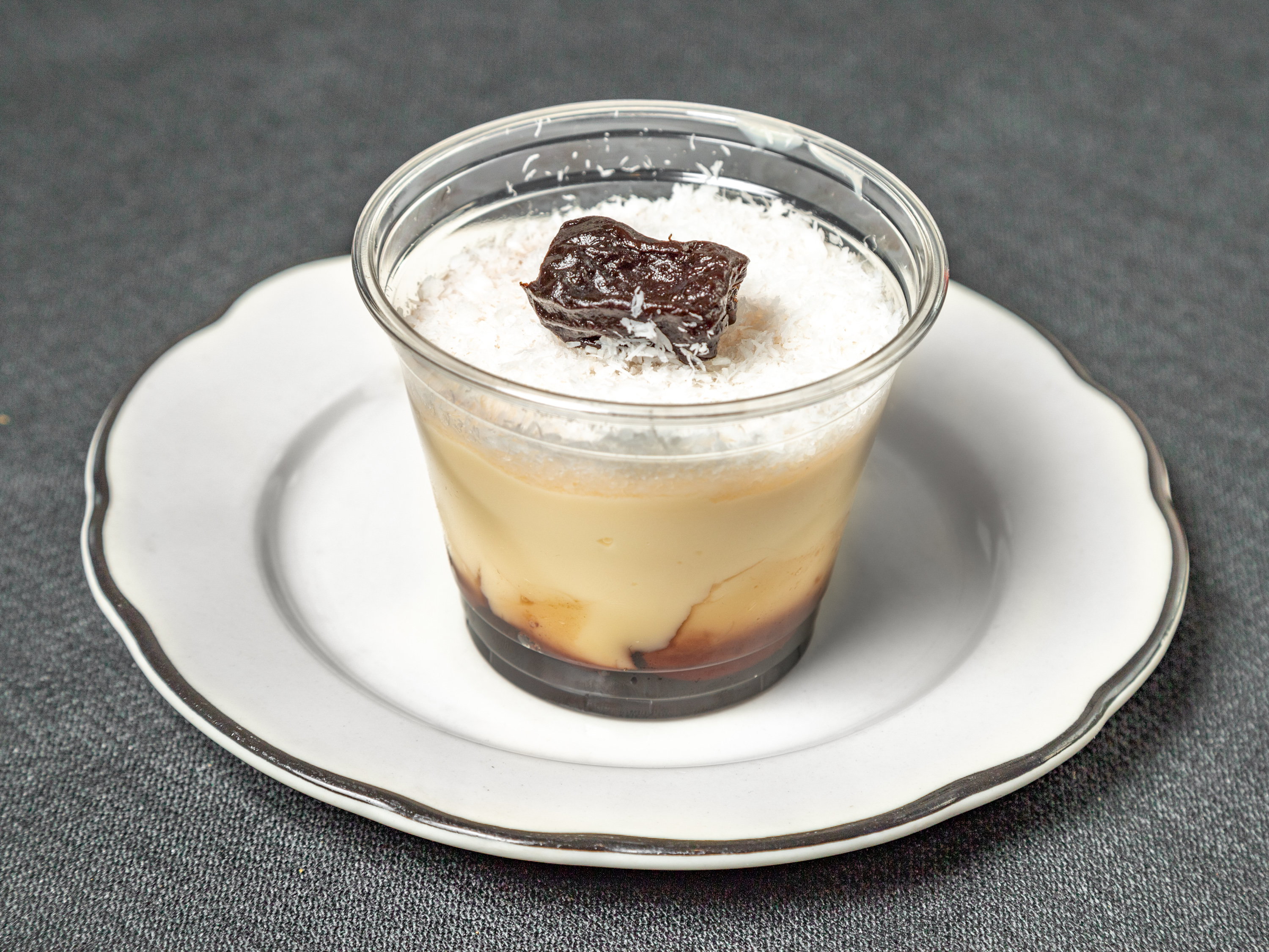 Order Coconut Flan with Prune food online from Oliveiras Peabody store, Peabody on bringmethat.com