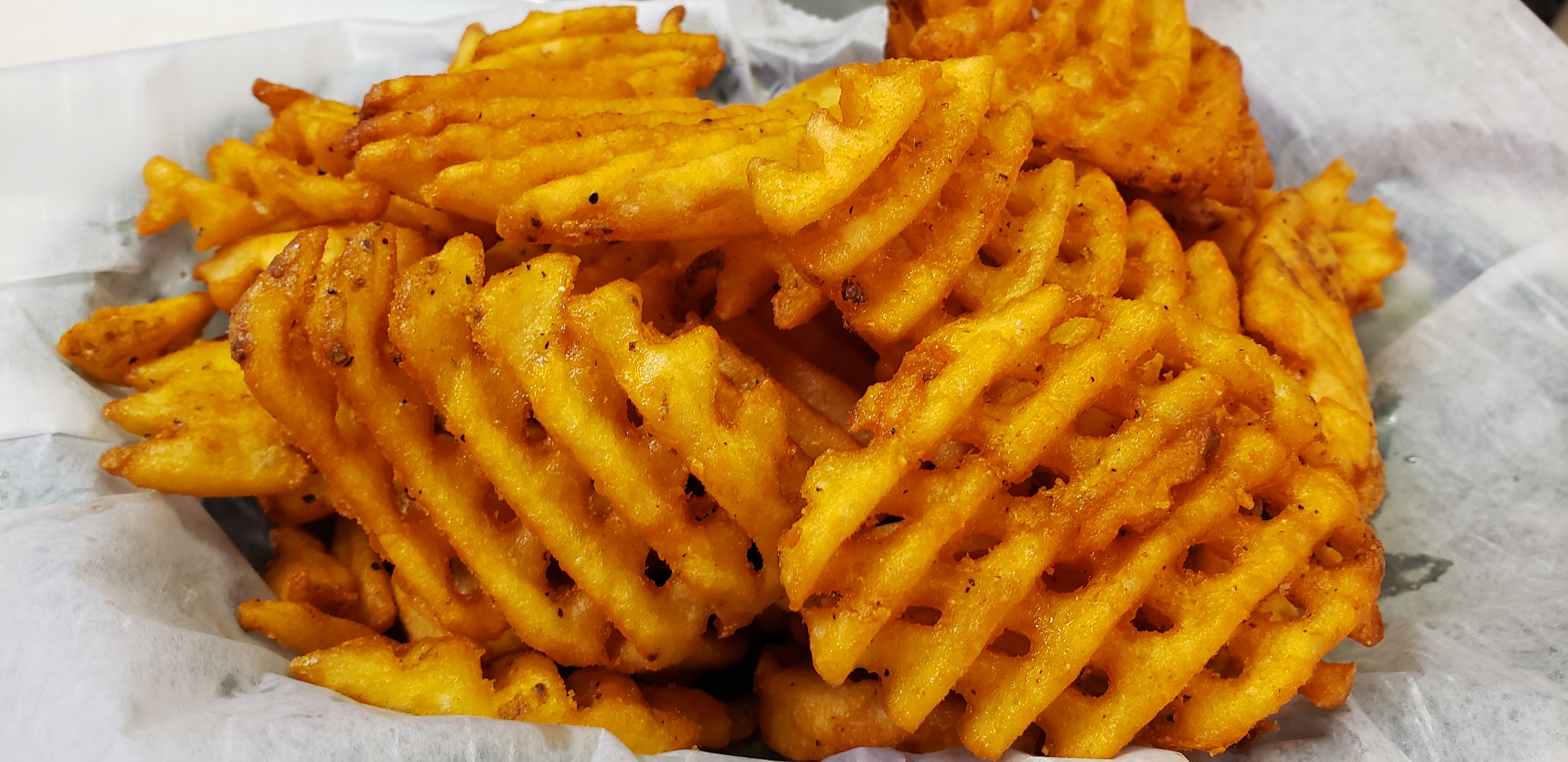 Order Waffle Fries food online from Mike Famous Steaks & Subs store, Newark on bringmethat.com