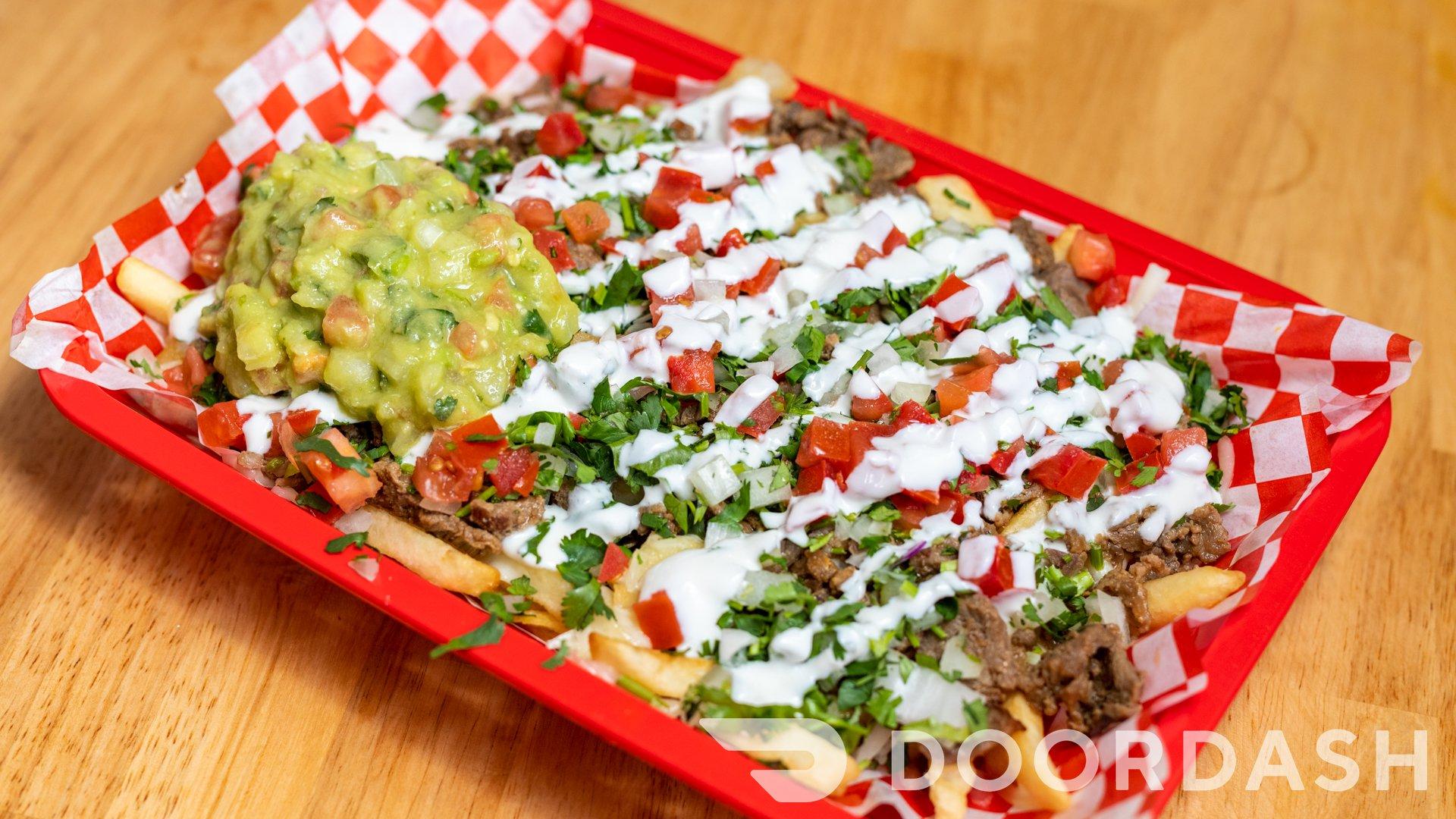Order Nacho Fries food online from Taqueria Reynoso store, Oakland on bringmethat.com