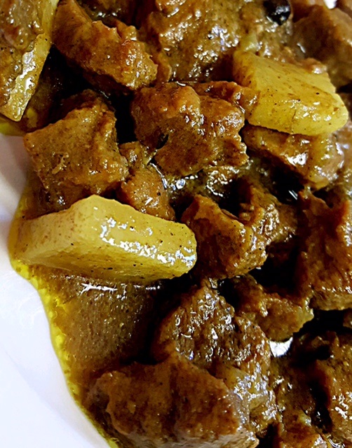Order Dinner Curried Goat food online from Pimento Grill store, Maplewood on bringmethat.com