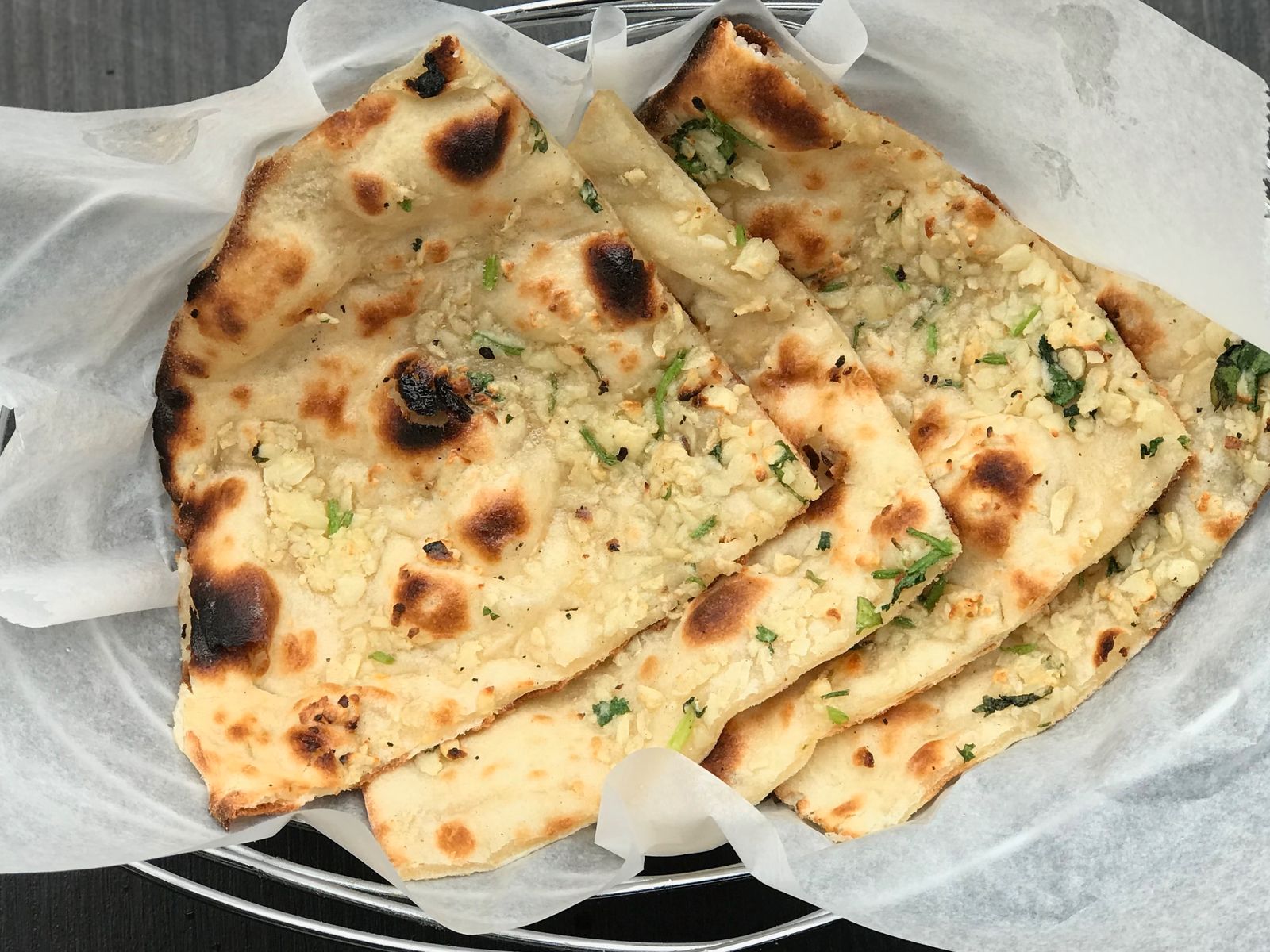 Order Garlic Naan food online from Mirchi Indian Kitchen store, Foster City on bringmethat.com