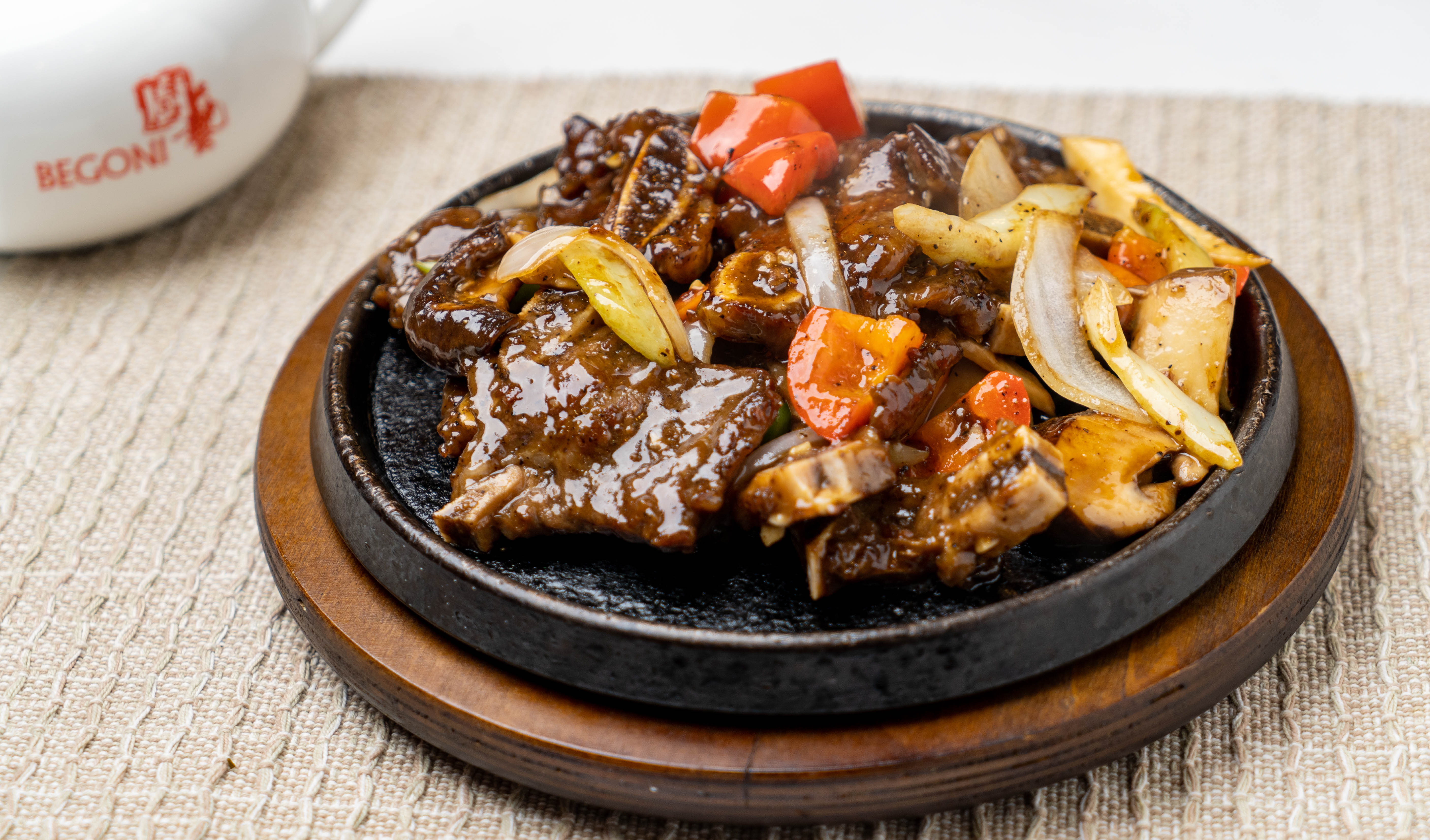 Order CR1. Hot Sizzling Beef Short Ribs food online from Begoni Bistro store, San Francisco on bringmethat.com