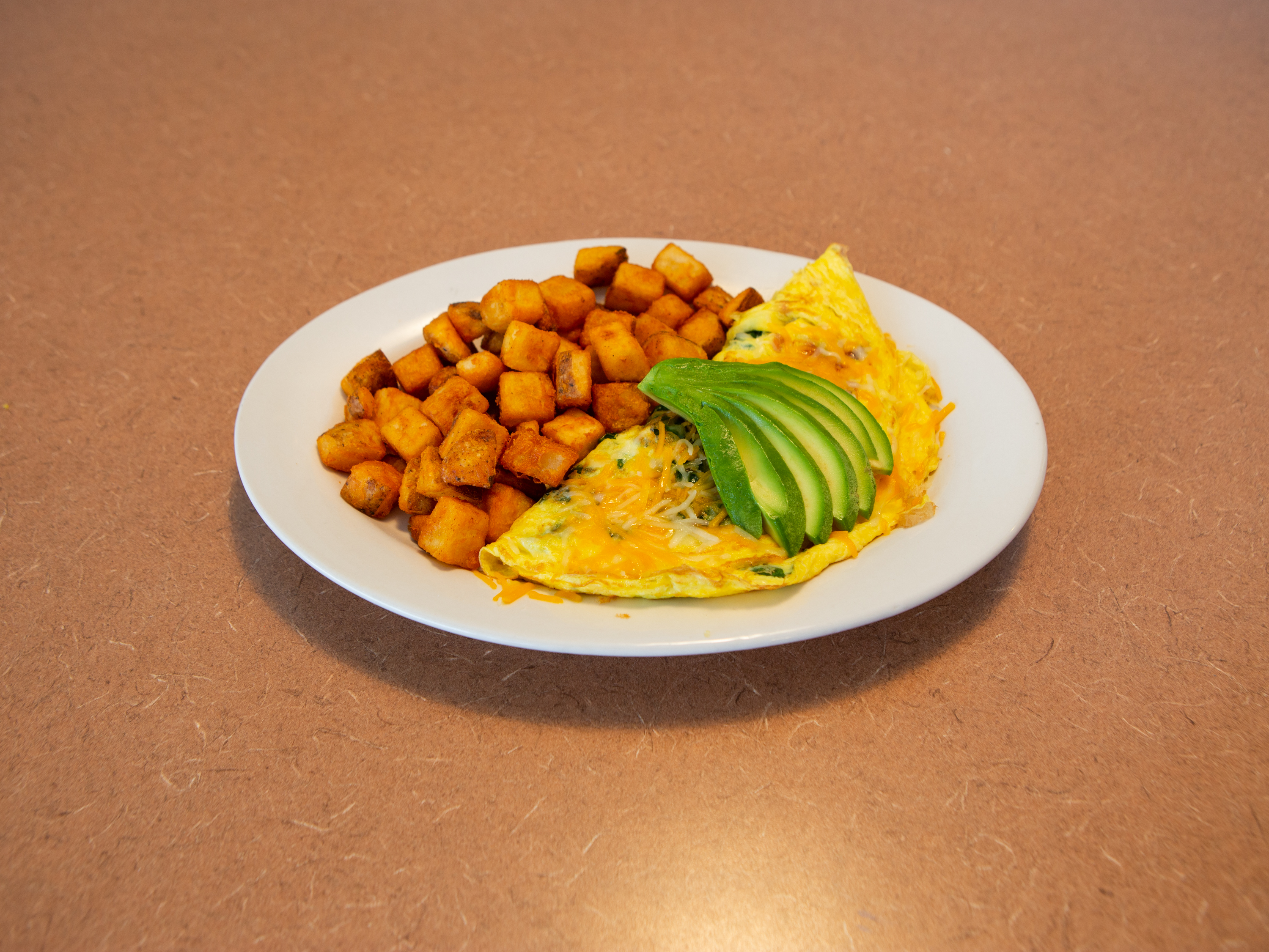 Order Avocado, Bacon and Spinach Omelette Breakfast food online from Ely's Restaurant store, Henderson on bringmethat.com