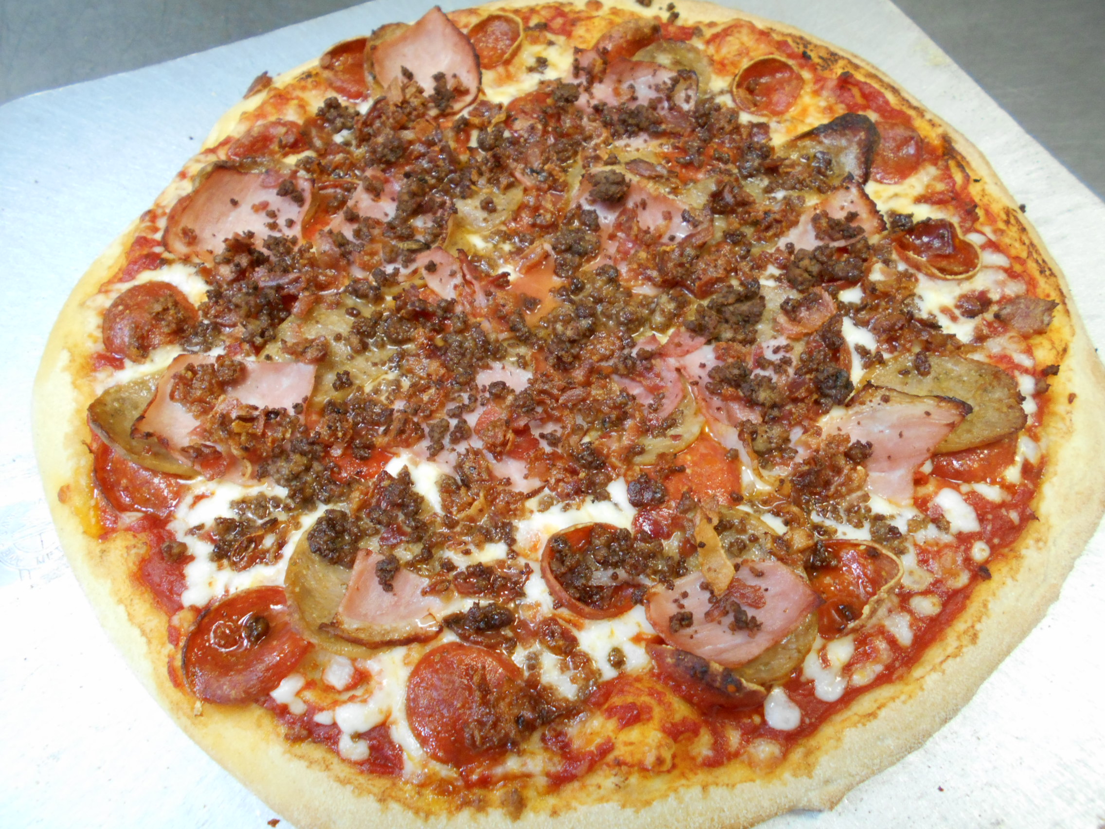 Order All Meat Pizza food online from Mama Mary Pizza store, Holland on bringmethat.com