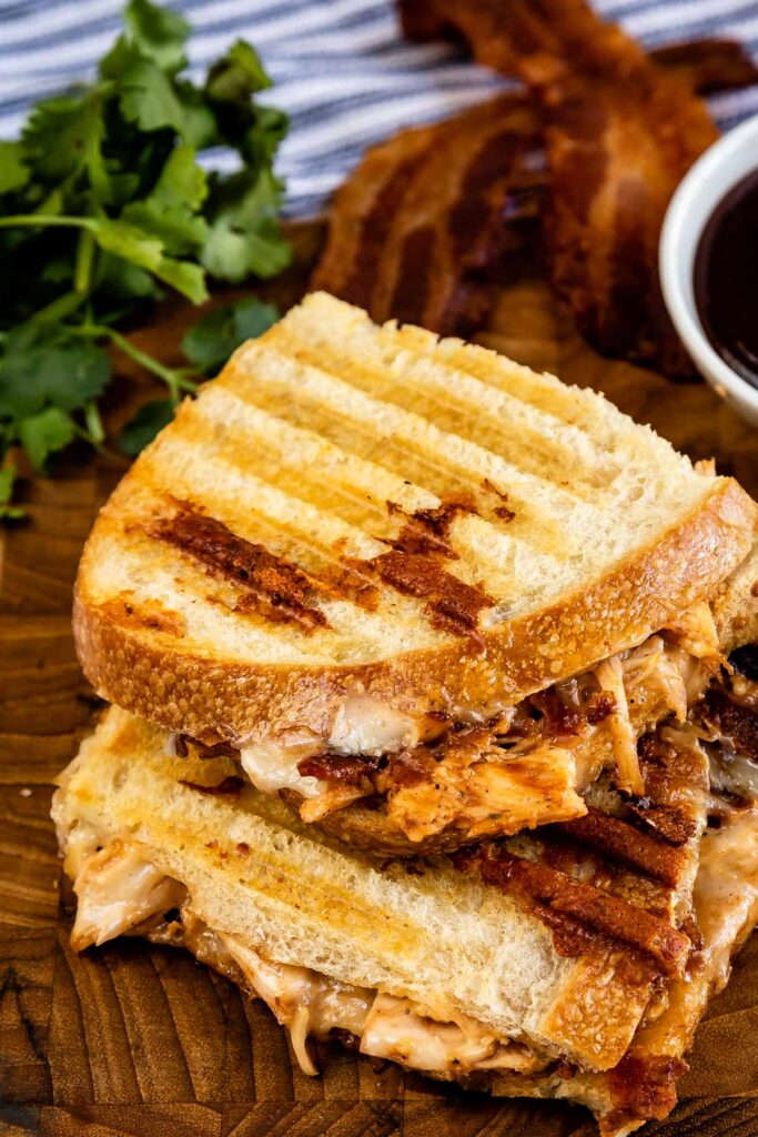 Order 11. BBQ Chicken Panini food online from Cafe Deli-Cious store, New York on bringmethat.com