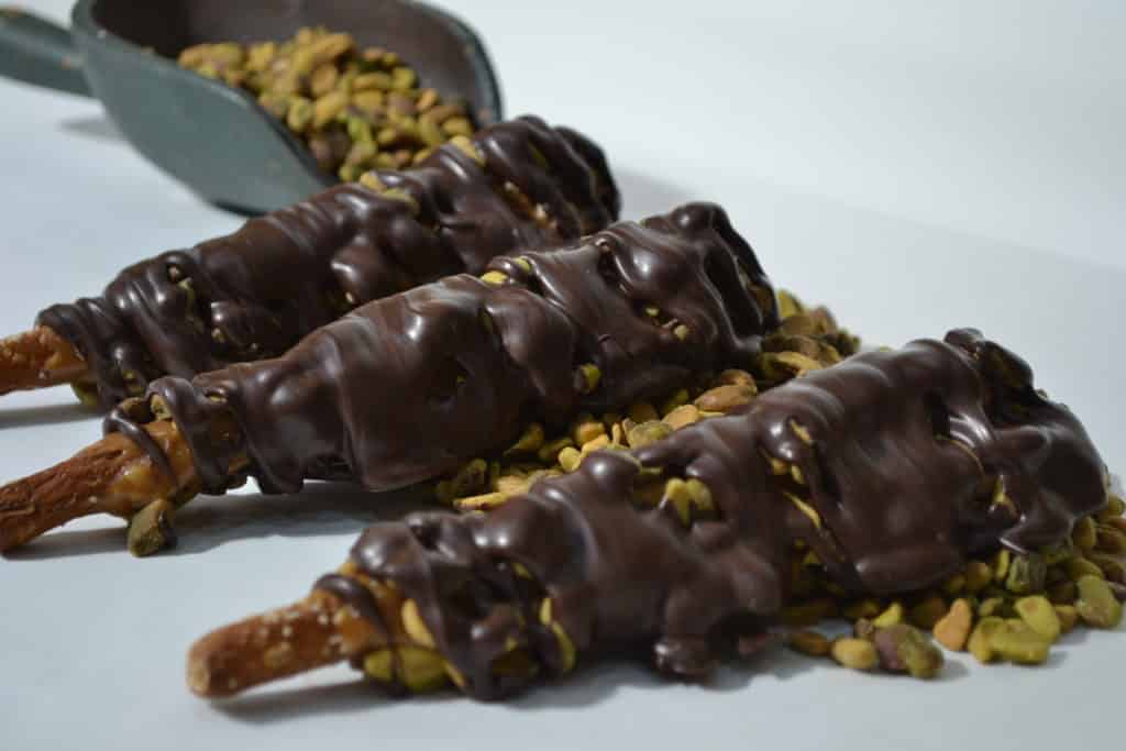 Order Caramel, Pistachio Nuts & Dark Chocolate food online from Candy Apple Shoppe store, Glenwood on bringmethat.com