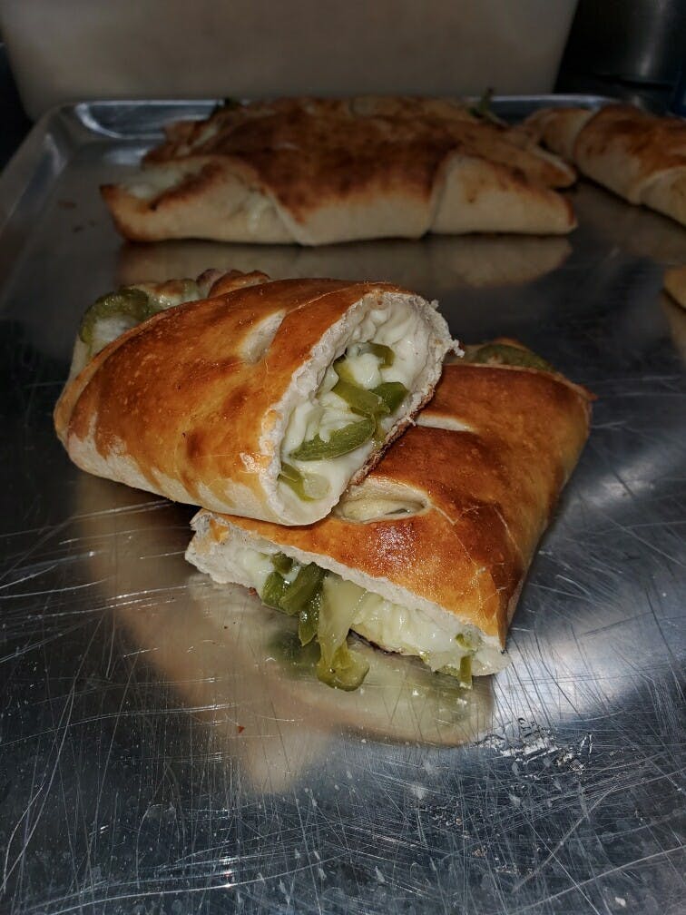 Order Vegetable Calzone - Calzone food online from Pizza On The 9 store, Lakewood on bringmethat.com