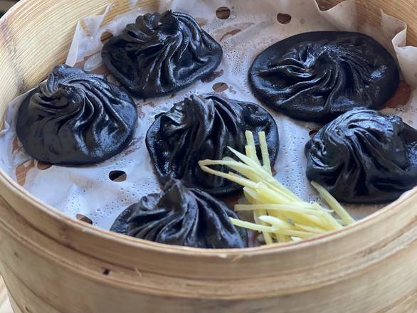 Order Black Malat Chili Oil Pork Soup Dumpling made with Squid ink & charcoal - Xiao Long Bao food online from The Iron-Teapot store, Los Angeles on bringmethat.com