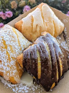 Order Chocolate Glazed food online from Dusty Biscuit Beignets store, Fort Worth on bringmethat.com
