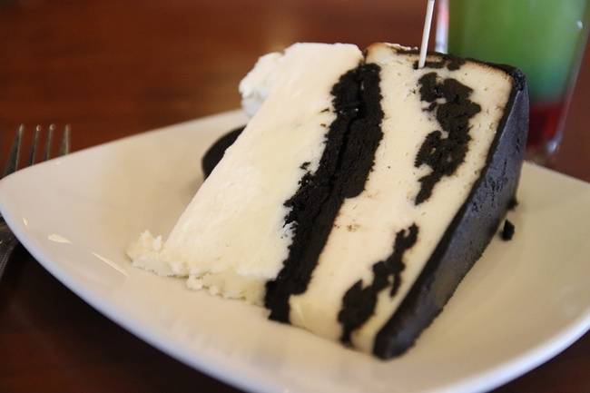 Order White Chocolate Oreo Cheesecake food online from Malone Grill & Bar store, Atlanta on bringmethat.com