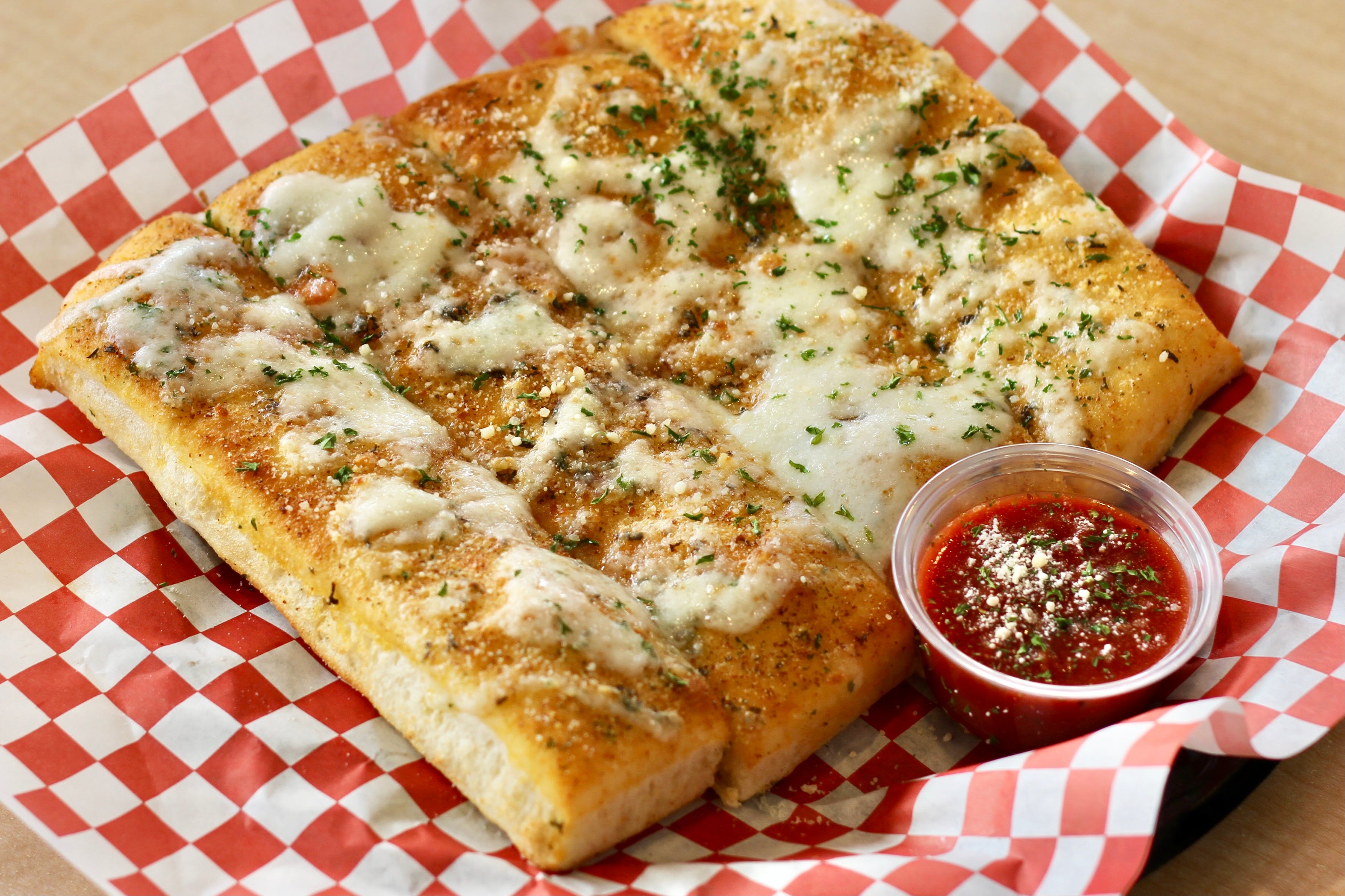 Order Garlic Bread with Melted Mozzarella Cheese - 4 Pieces food online from California Pizza Place store, Anaheim on bringmethat.com