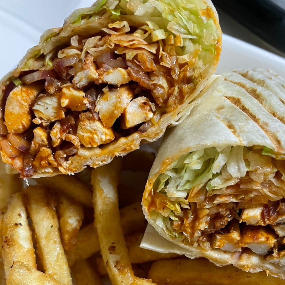 Order 7. Spicy Grilled Chicken Wrap - Wrap food online from Davila's Pizza & Restaurant store, Hackettstown on bringmethat.com