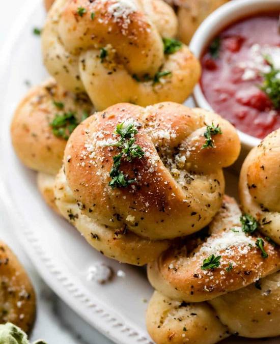 Order Garlic Knots (12) food online from The Pizza Cutters store, Syracuse on bringmethat.com