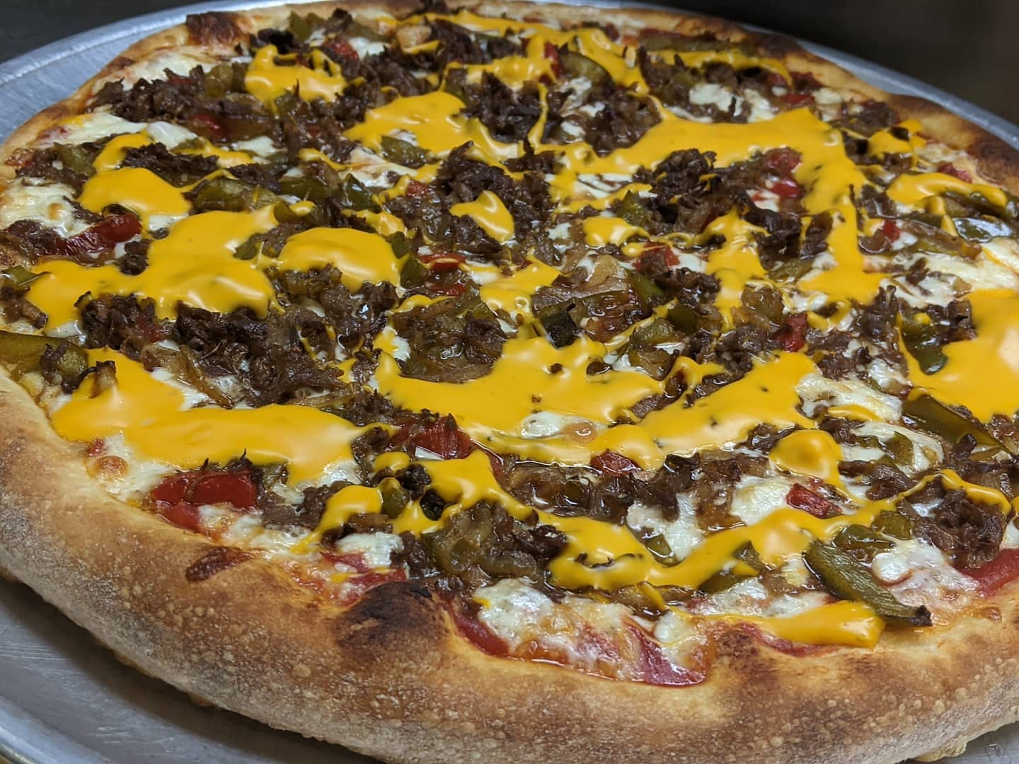 Order Philly Cheesesteak Pizza - Medium 14" food online from Lucino Pizza store, Las Vegas on bringmethat.com