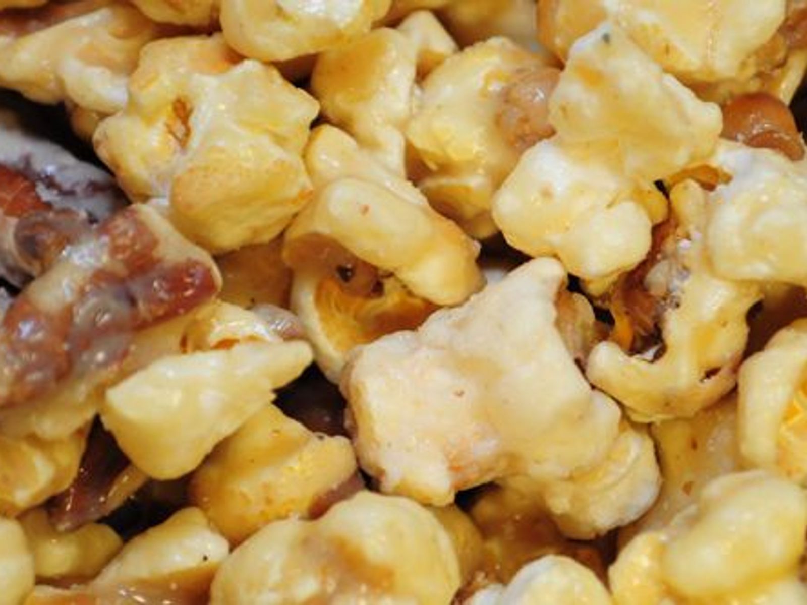 Order BUTTER PECAN food online from Poparazzis Popcorn store, Houston on bringmethat.com