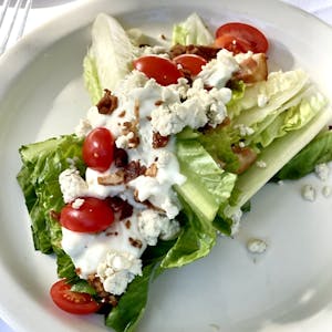 Order Romaine Wedge Salad food online from Barney's store, Locust Valley on bringmethat.com