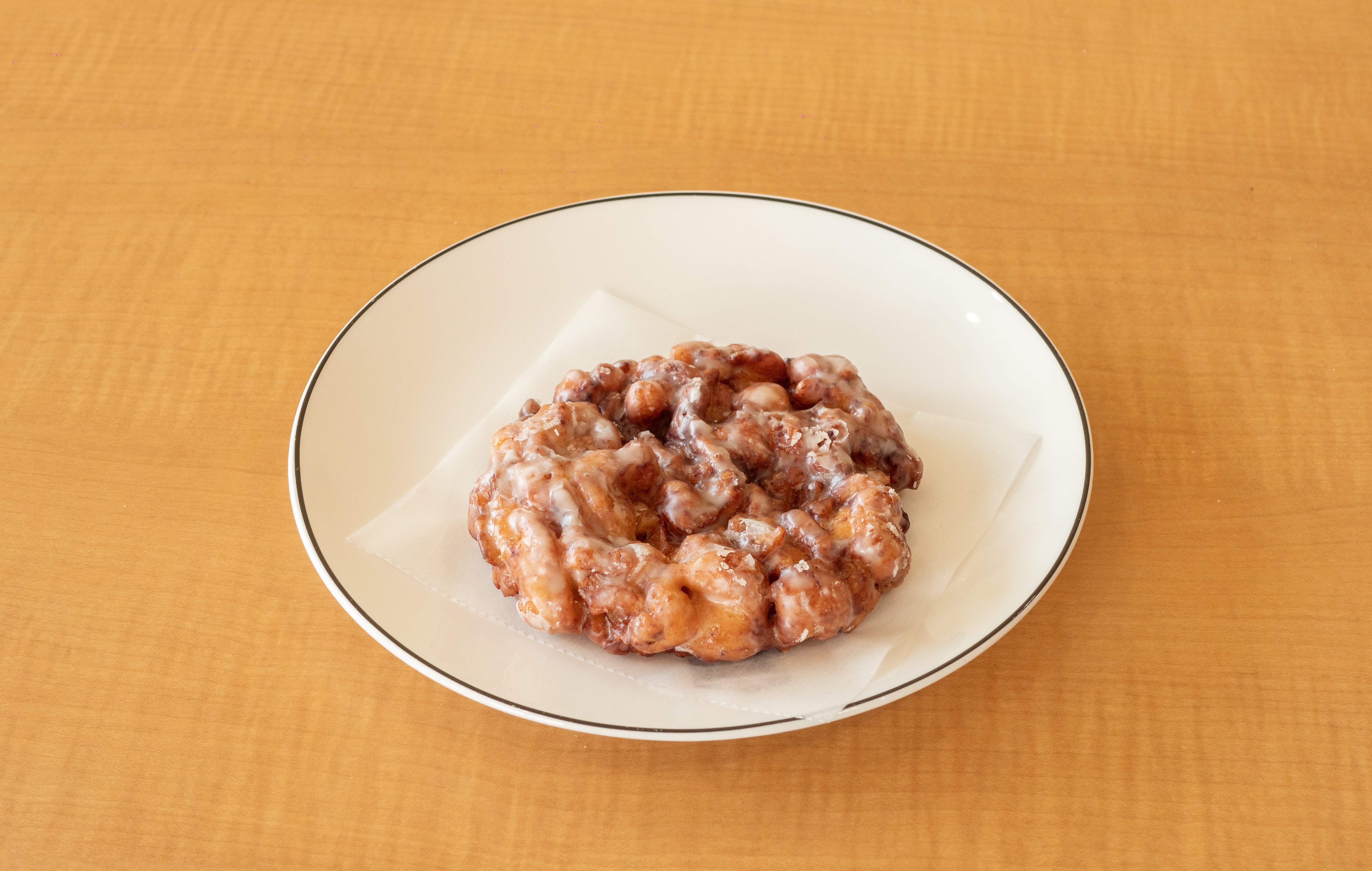 Order Apple Fritter food online from Sara Donuts store, Euless on bringmethat.com