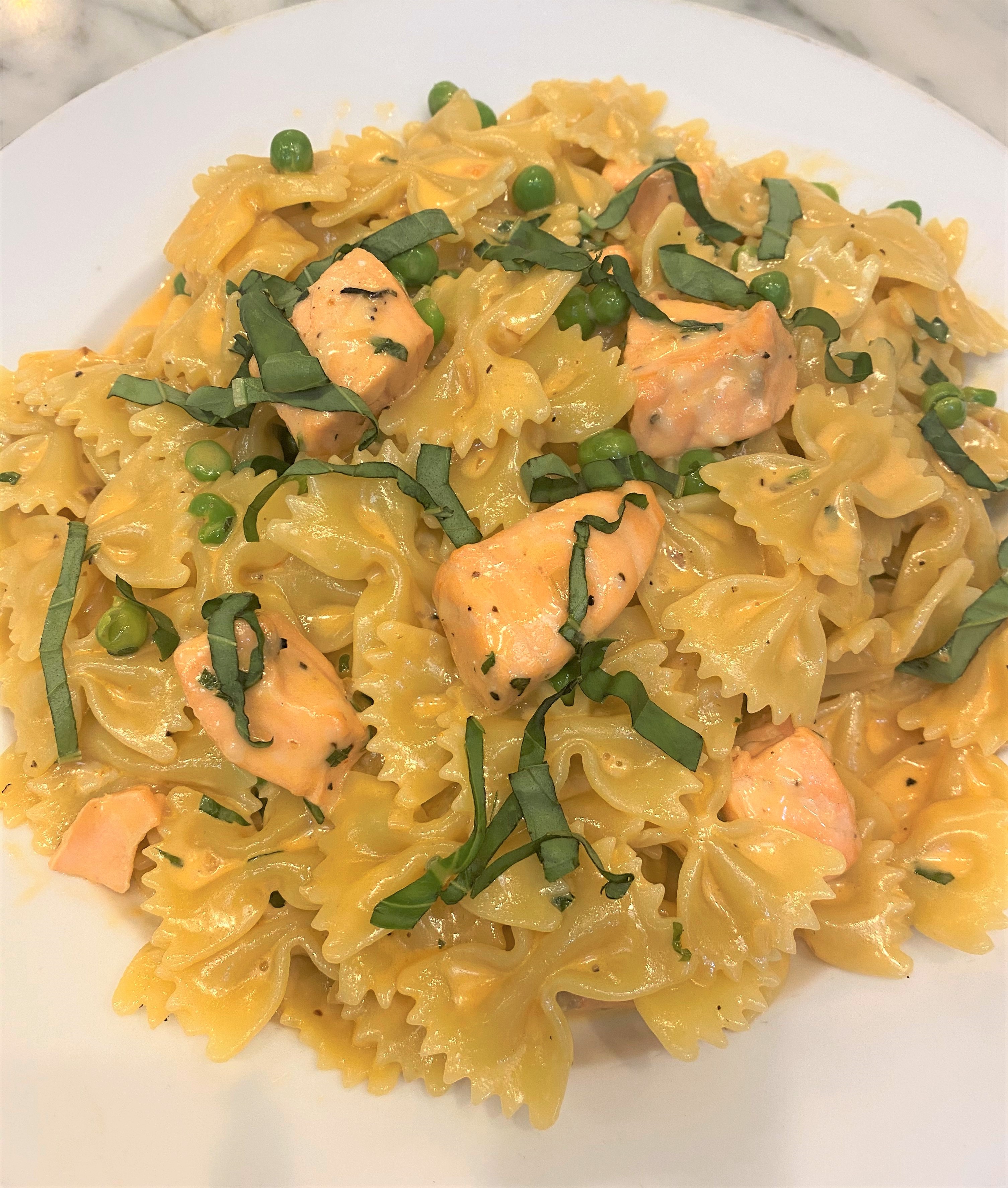 Order Salmon Farfalle Pasta food online from Tonino's Place Pizzeria store, Woodland Hills on bringmethat.com