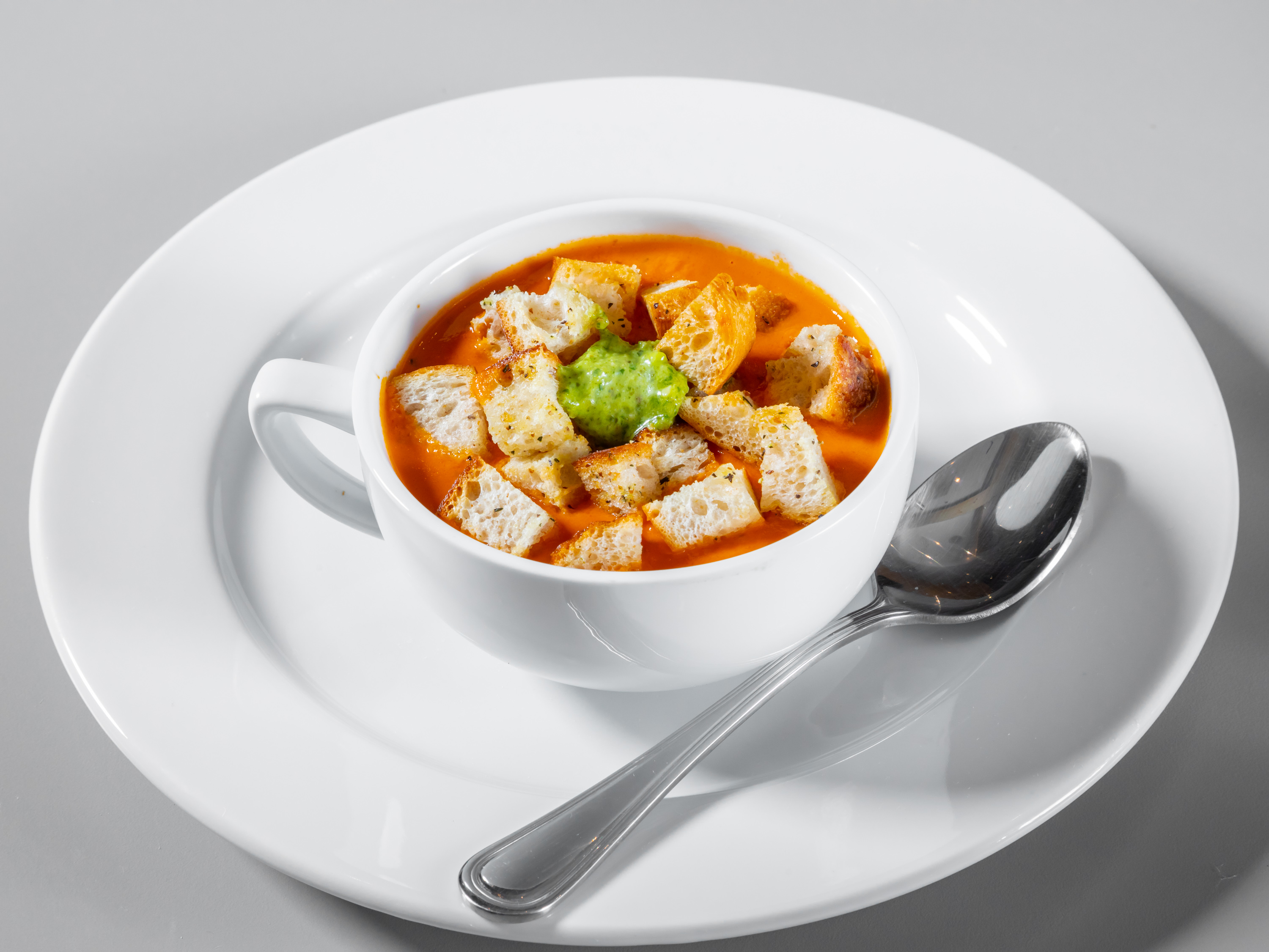 Order Creamy Tomato Soup with Croutons & Arugula Pesto food online from La Boulangerie San Francisco store, Irvine on bringmethat.com