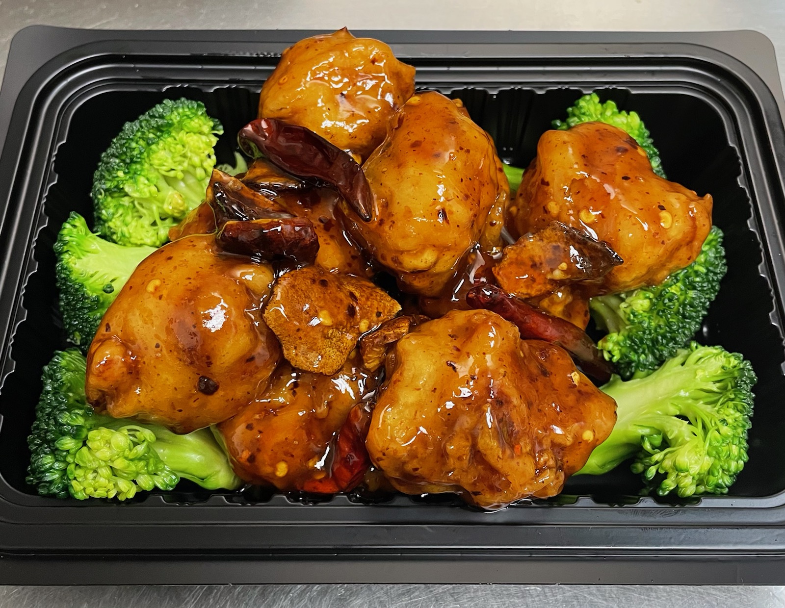 Order CS13. Orange Chicken food online from Szechuan Chinese Restaurant store, Dallas on bringmethat.com