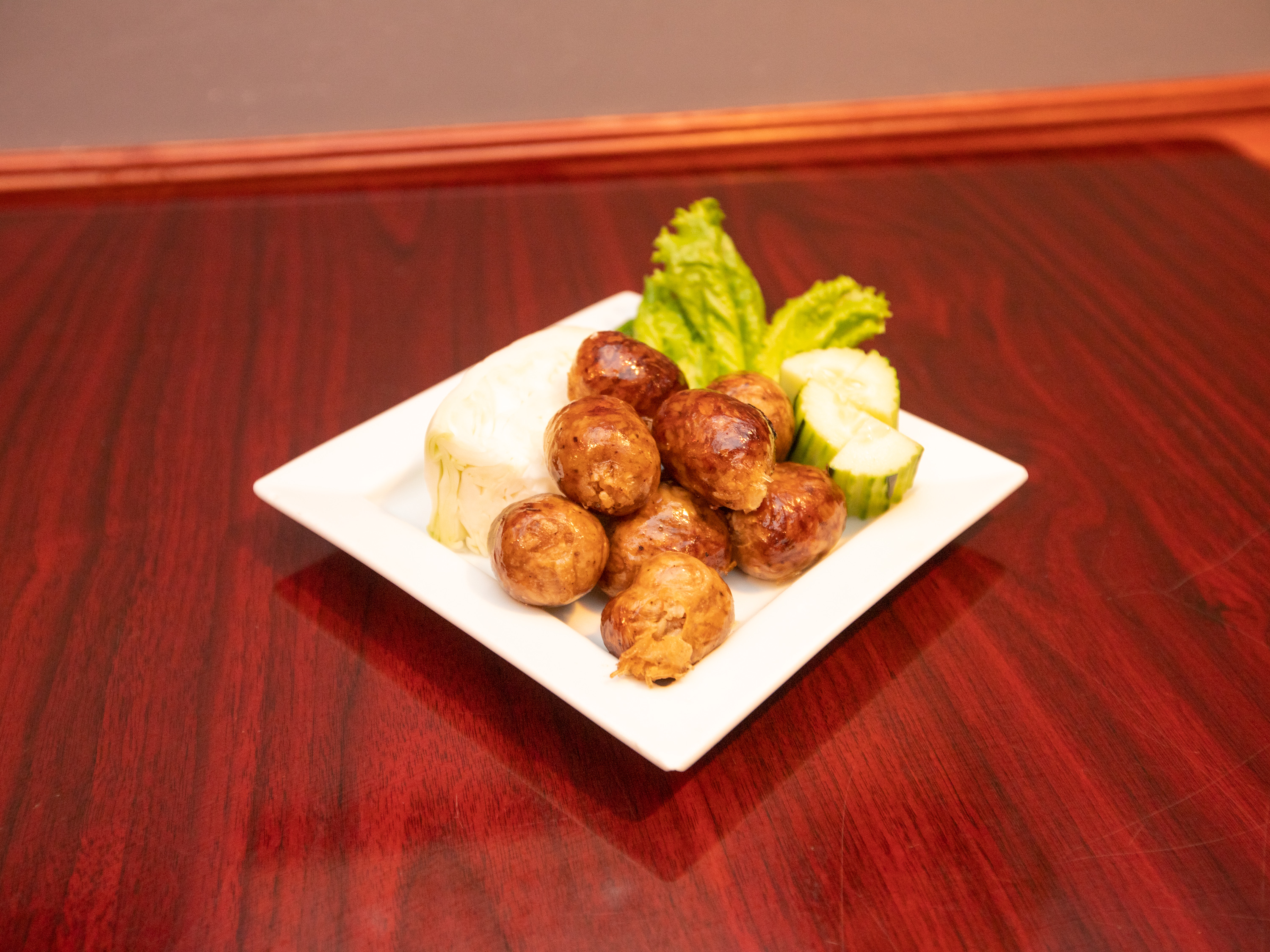 Order Rice Ball Sausages) food online from Salween Thai Restaurant store, Omaha on bringmethat.com