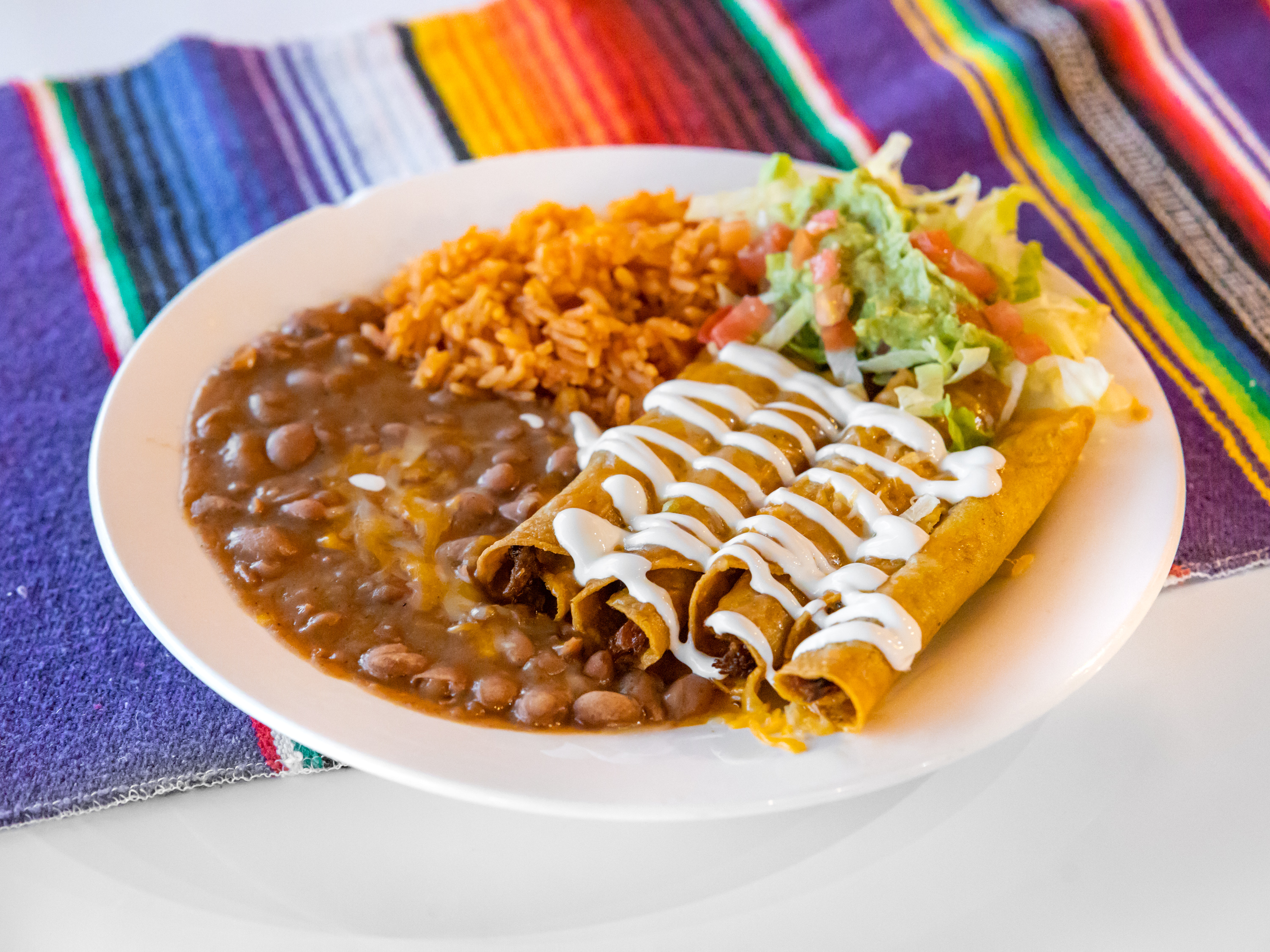 Order Flautas Plate food online from El Mariachi Authentic Mexican Food store, Cedar Crest on bringmethat.com