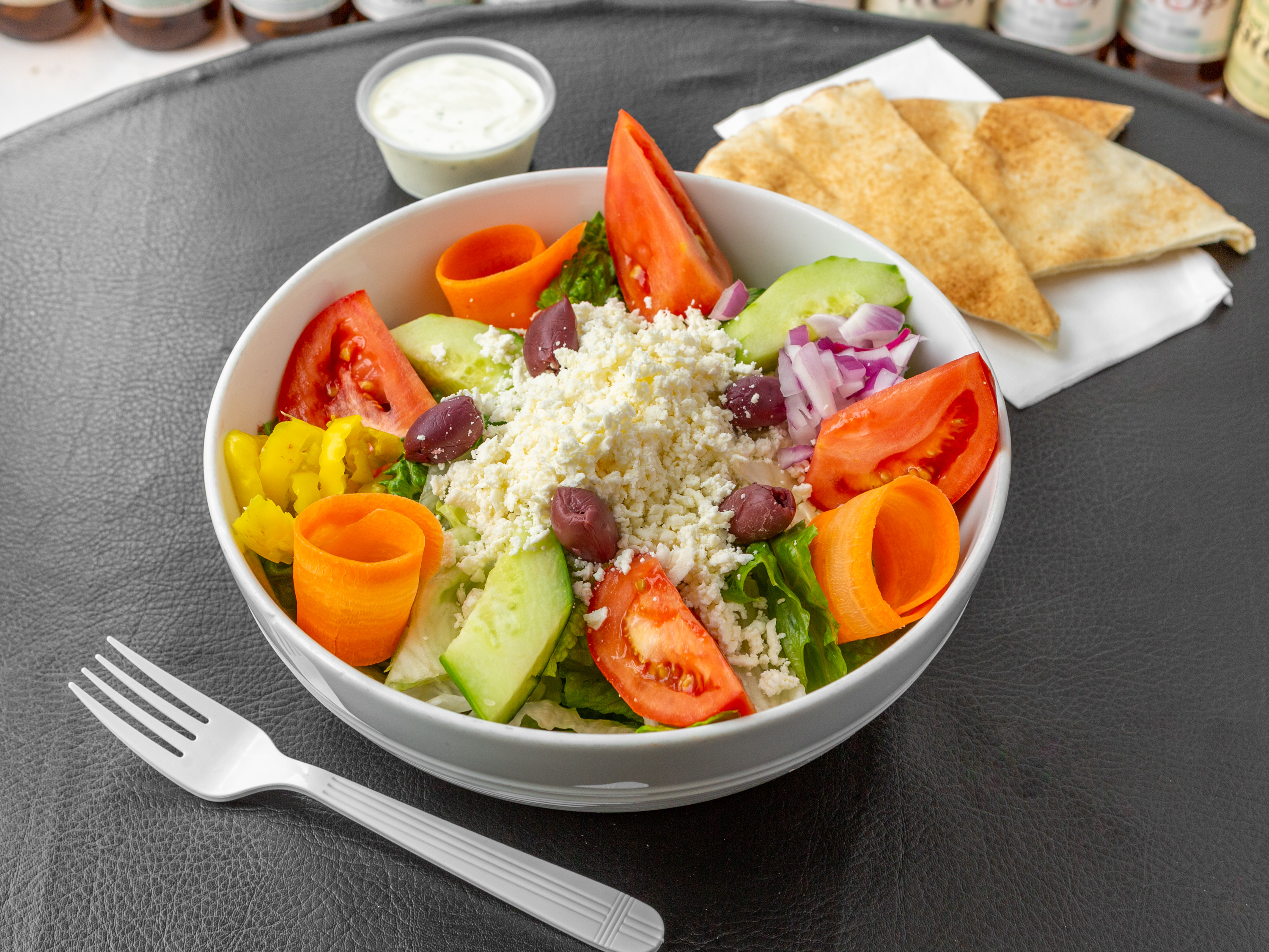 Order Greek Salad food online from University House of Pizza store, Boston on bringmethat.com
