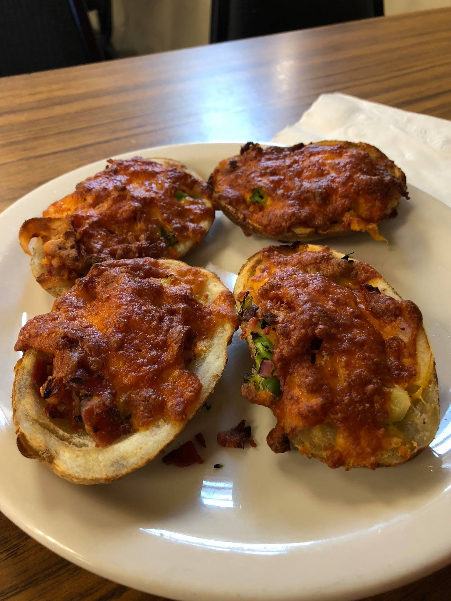 Order Loaded Potato Skins - 4 Pieces food online from Pisanello Pizza store, Waterville on bringmethat.com