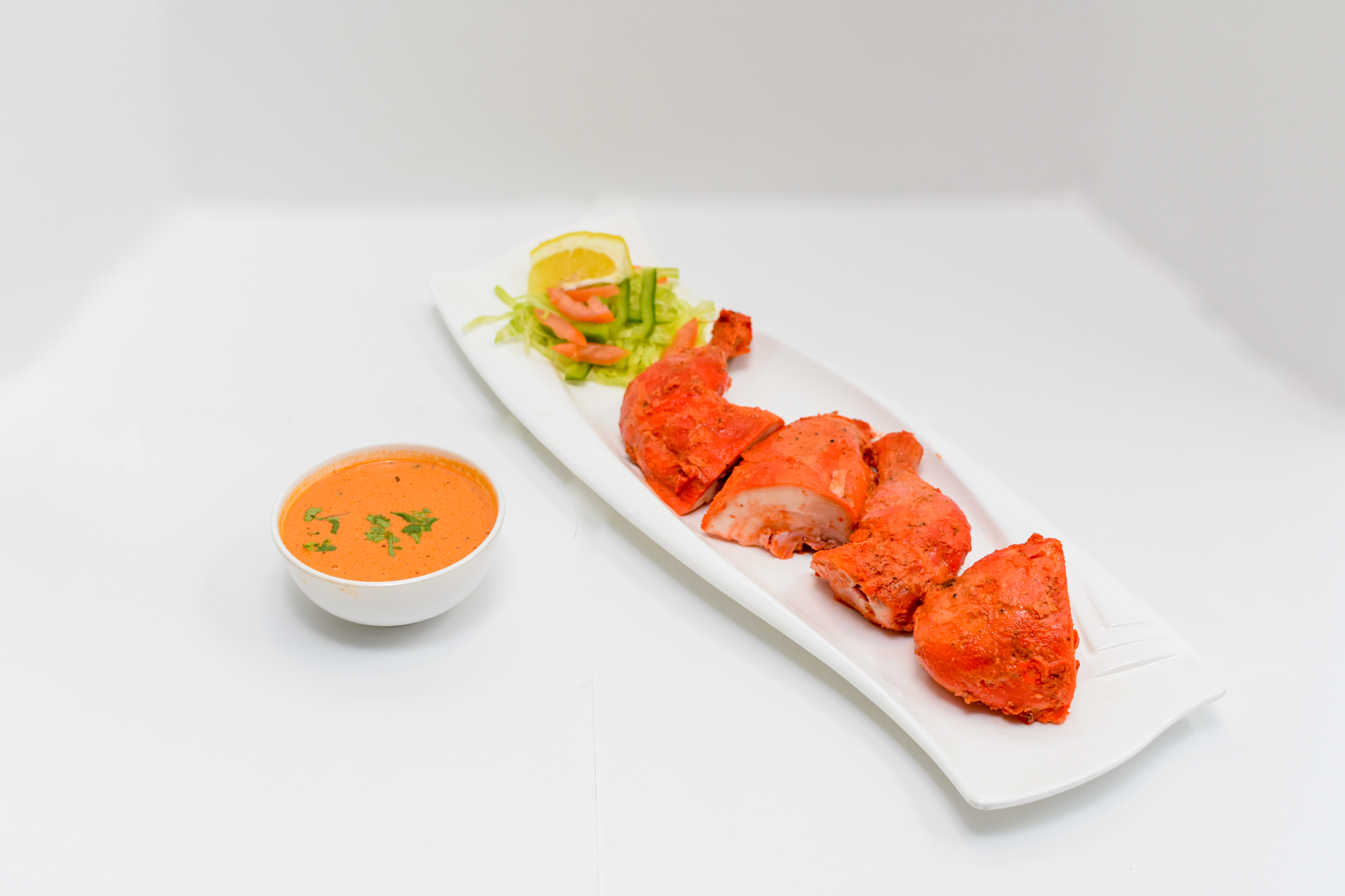 Order Half Tandoori Chicken food online from Rangla Punjab Indian Cuisine store, Arlington on bringmethat.com
