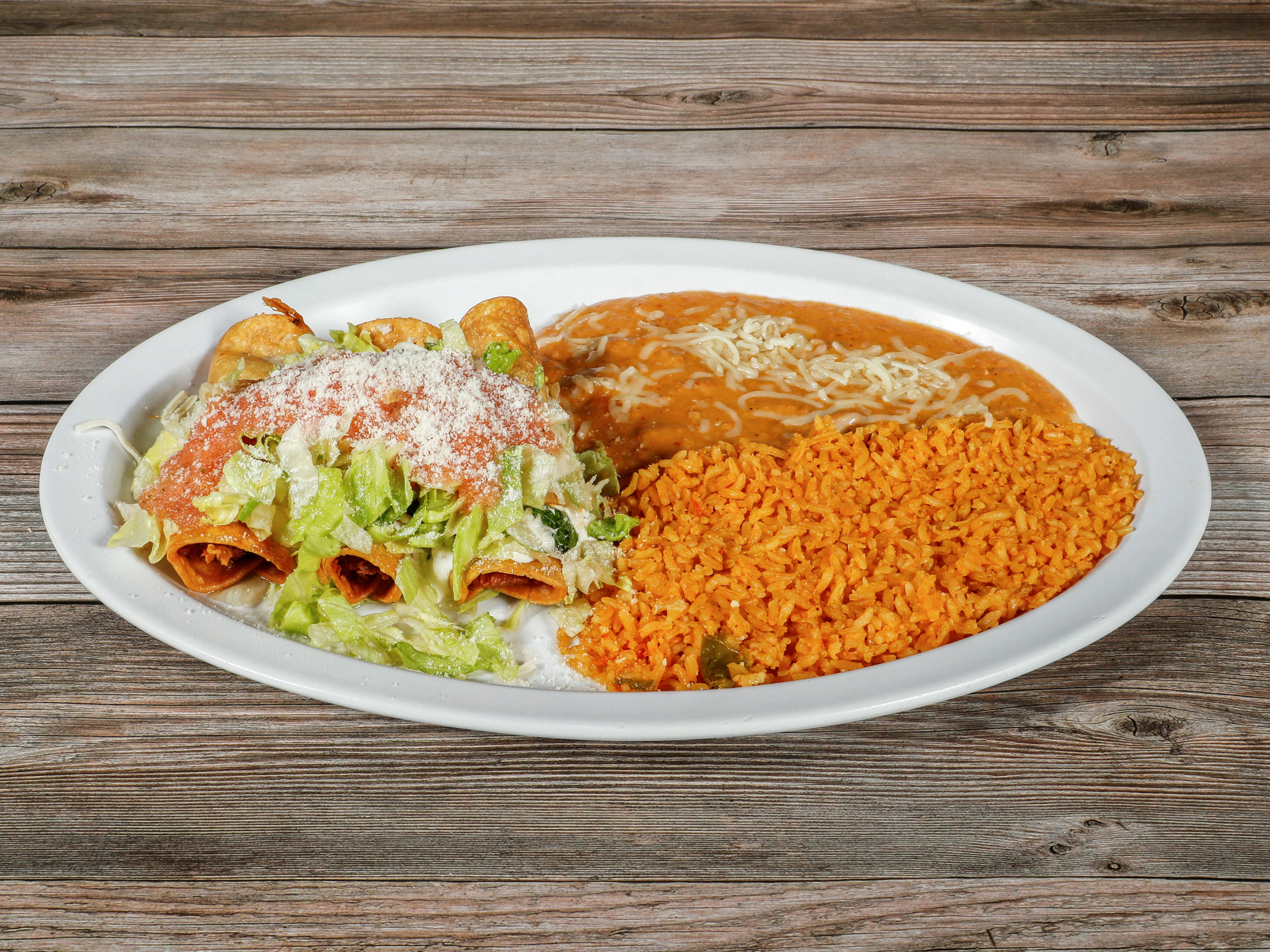 Order 3 Flautas with Rice & Beans food online from La Perla Taqueria Mexican Grill store, Chico on bringmethat.com
