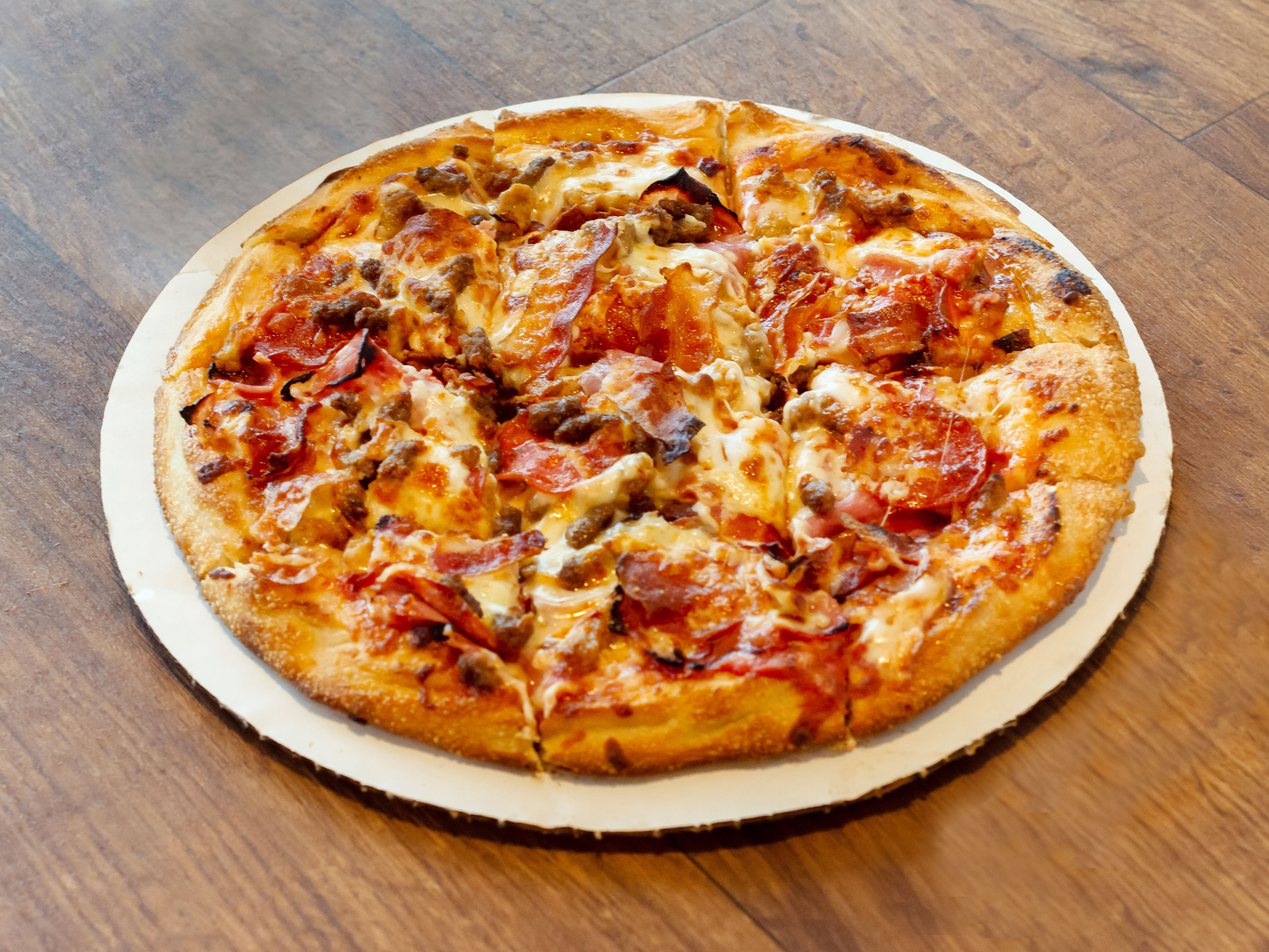 Order Bellacino's Meat Eater Pizza food online from Bellacino's Pizza & Grinders store, Richmond on bringmethat.com