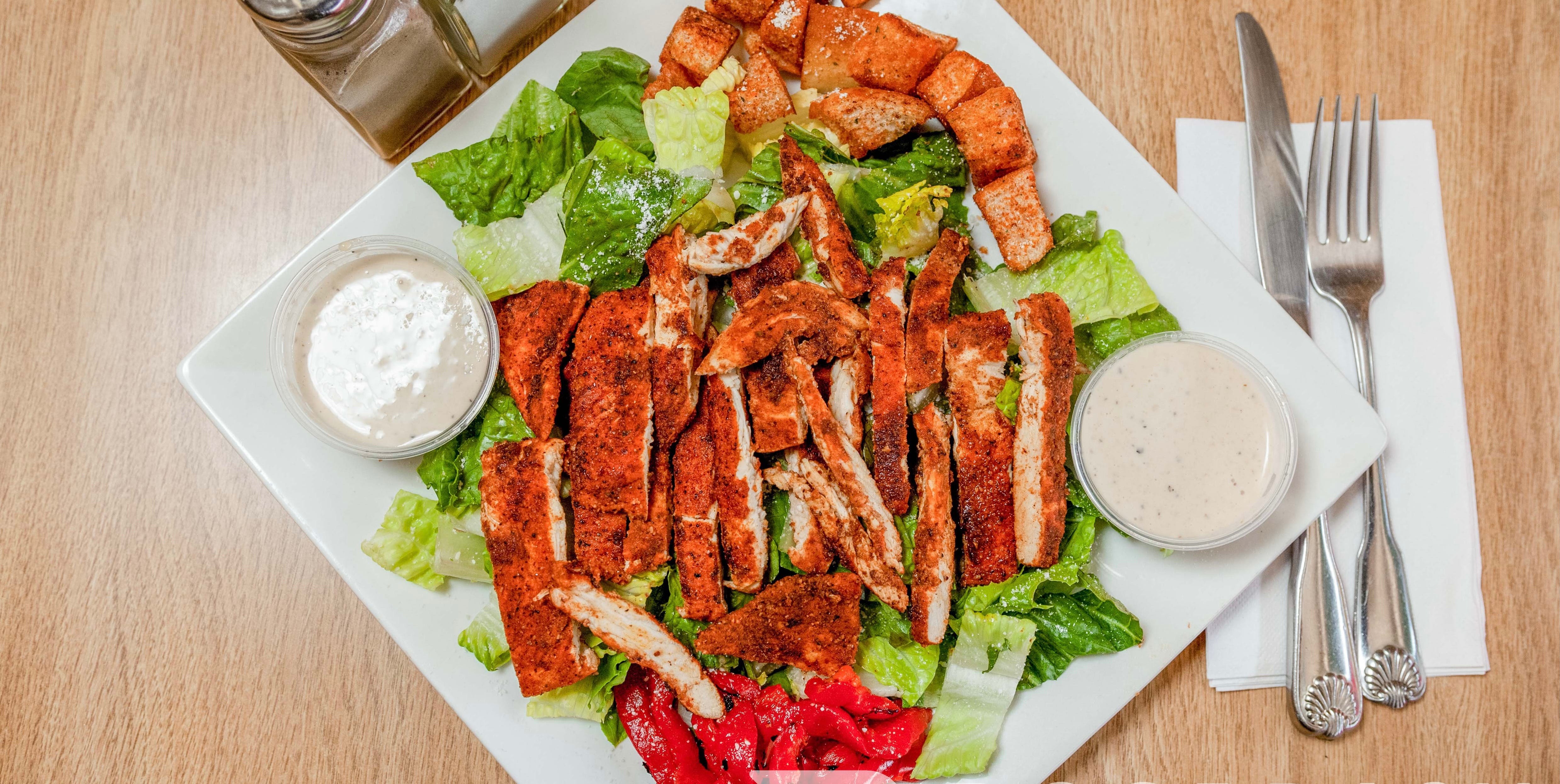 Order Caesar Salad with Blackened Chicken - Salads food online from Nonna Rosa Pizzeria store, Bridgeport on bringmethat.com