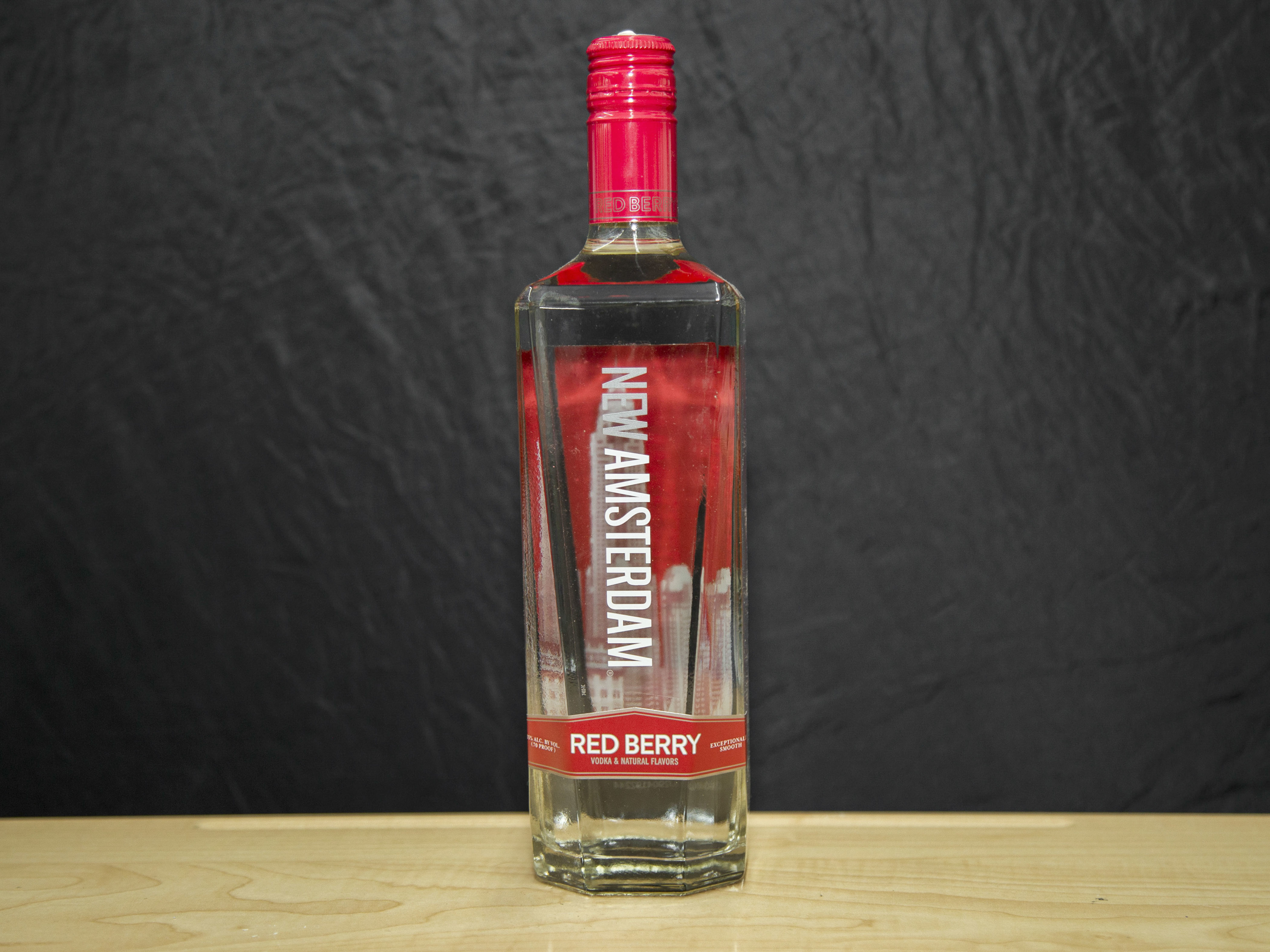 Order New Amsterdam Red Berry Flavored, 750 ml. Vodka (35.0% ABV) food online from Platinum Star Food & Liquor store, Chicago on bringmethat.com